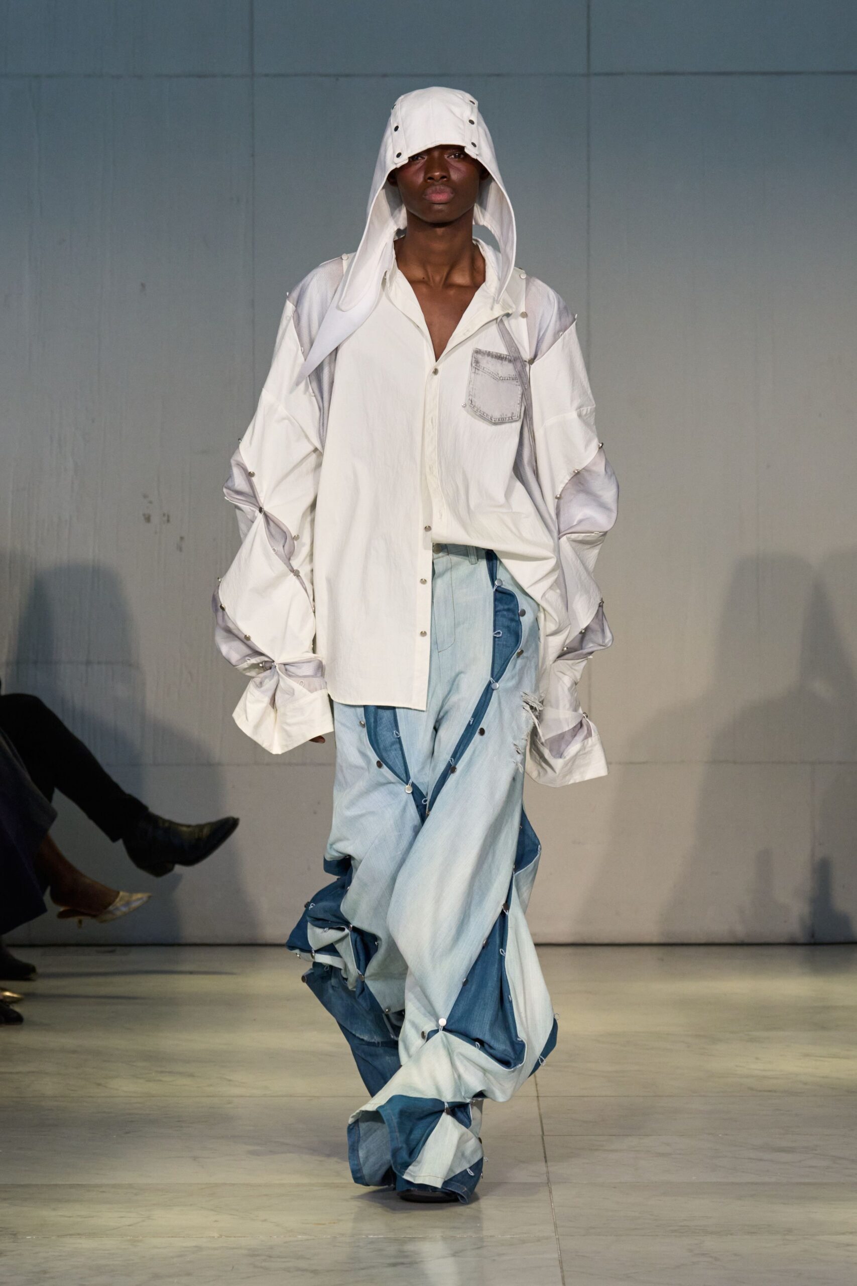 oversized white shirt with relaxed blue pants
