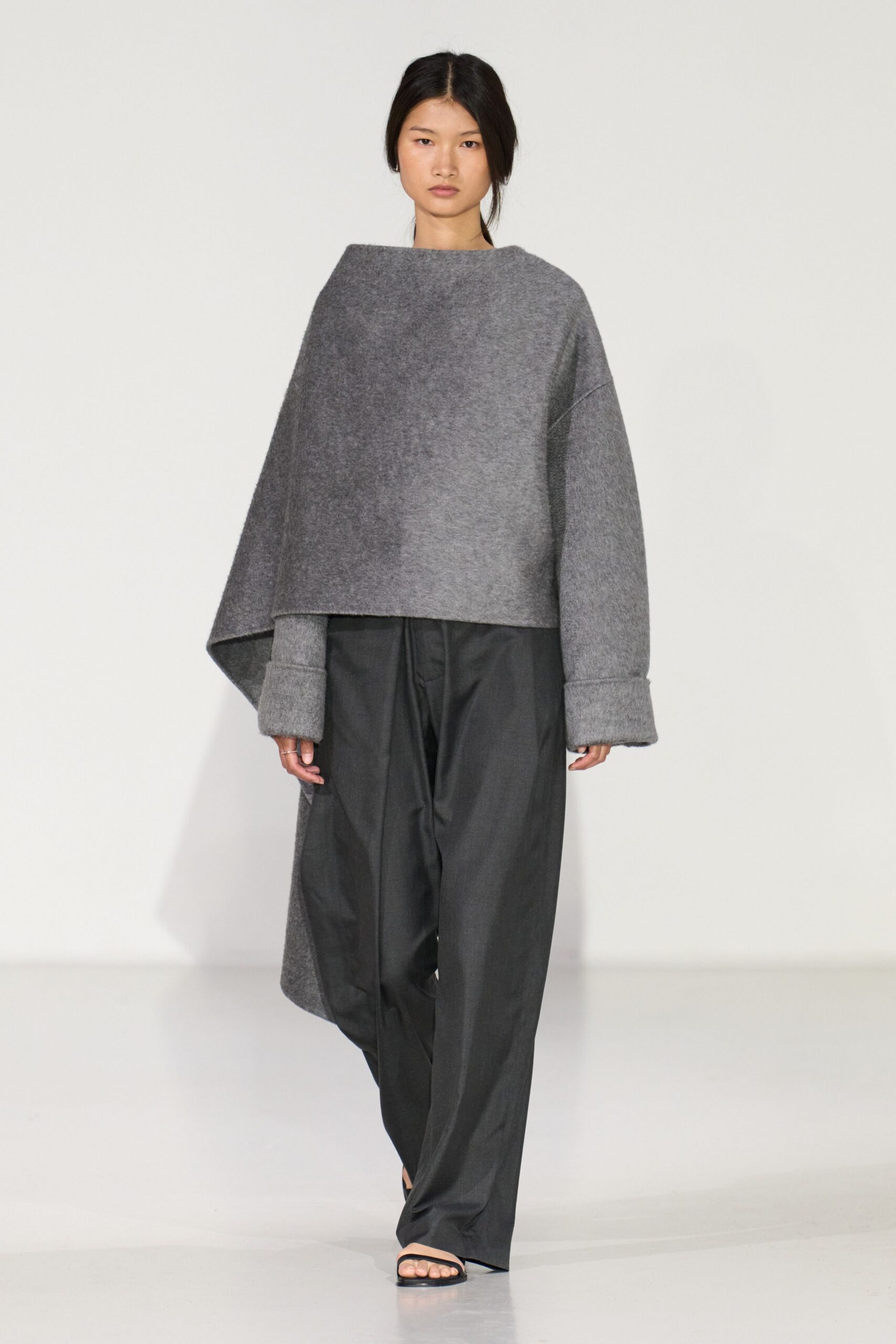 gray oversized top with black pants