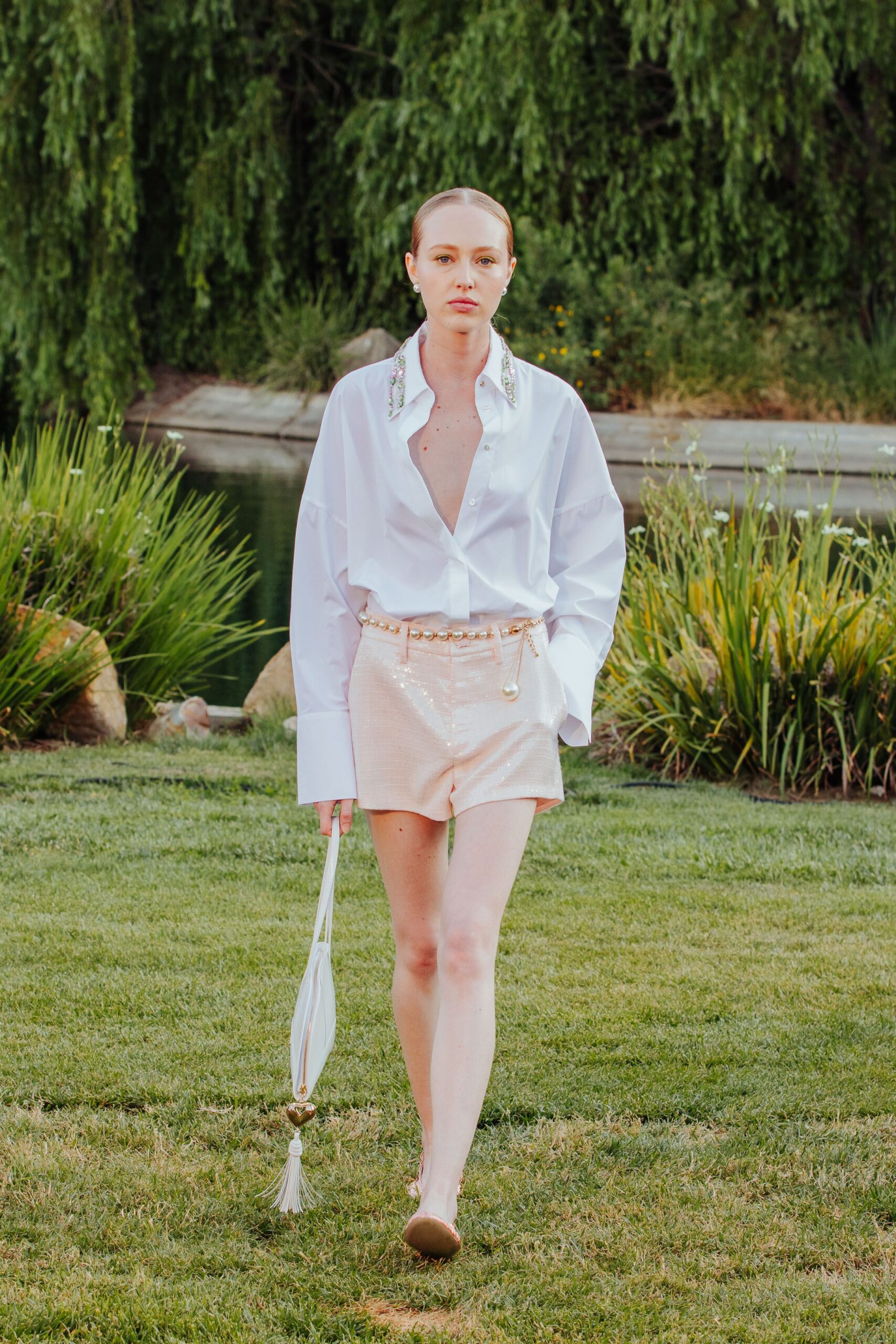 white shirt beige shorts