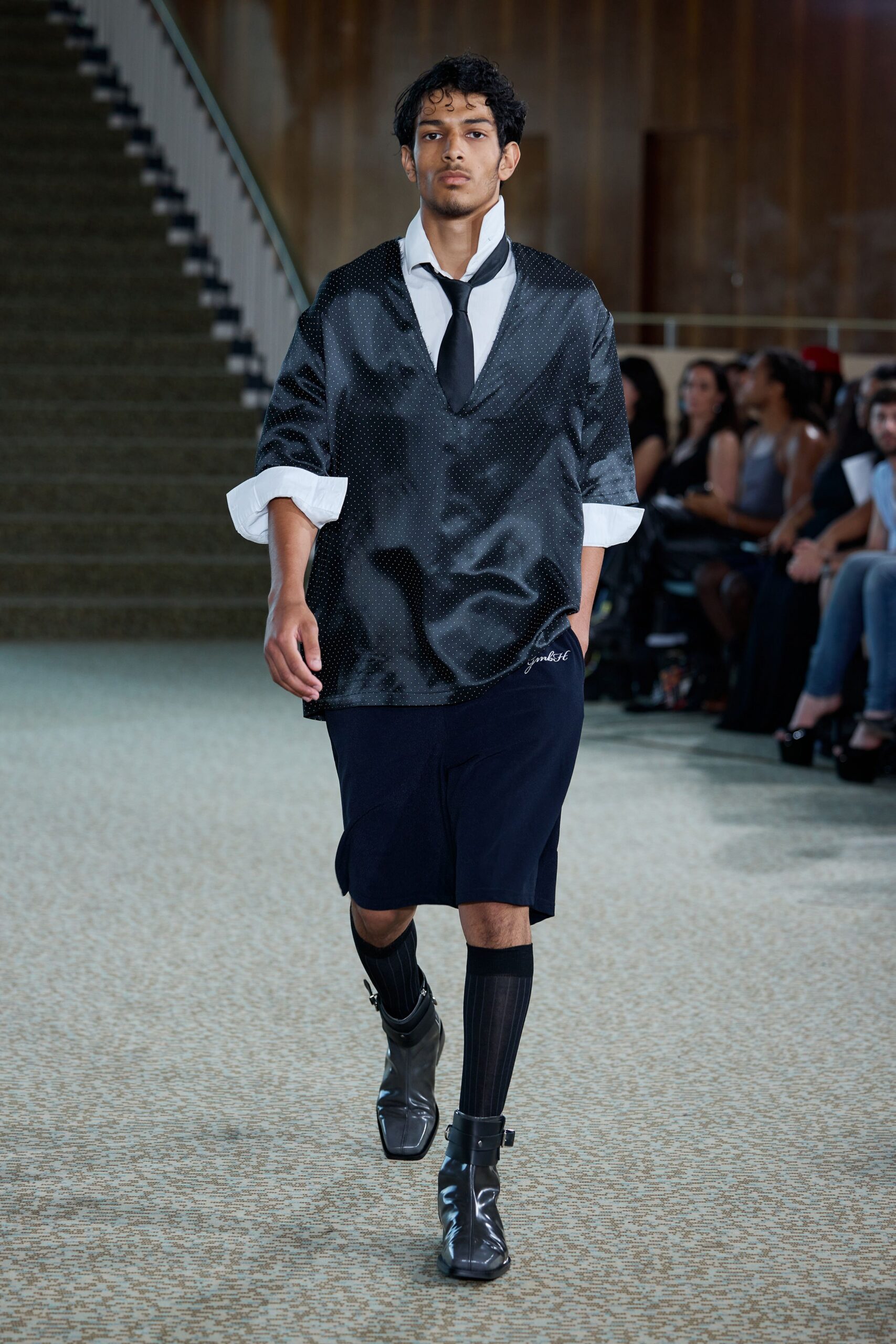 black relaxed shirt with navy skirt