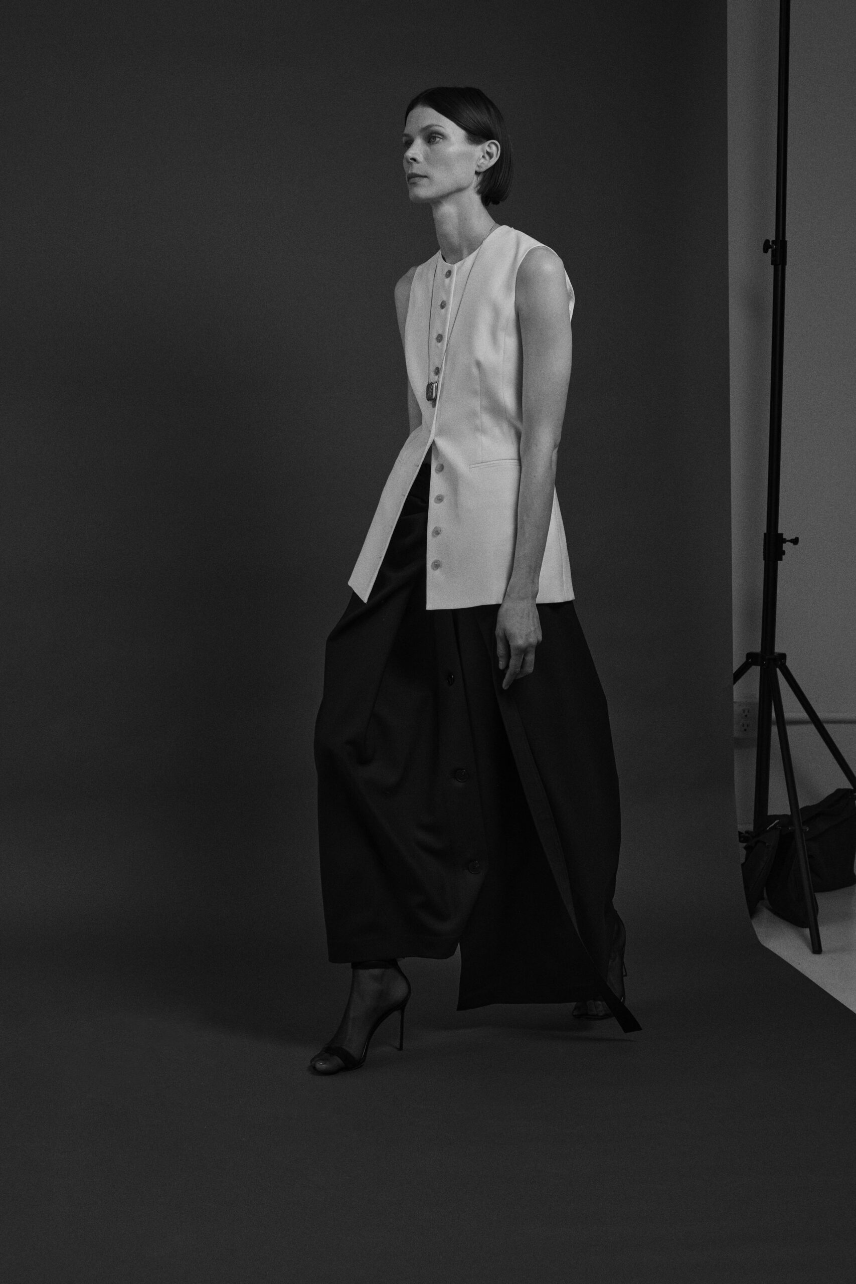 white cotton sleeveless collared fitted buttoned vest