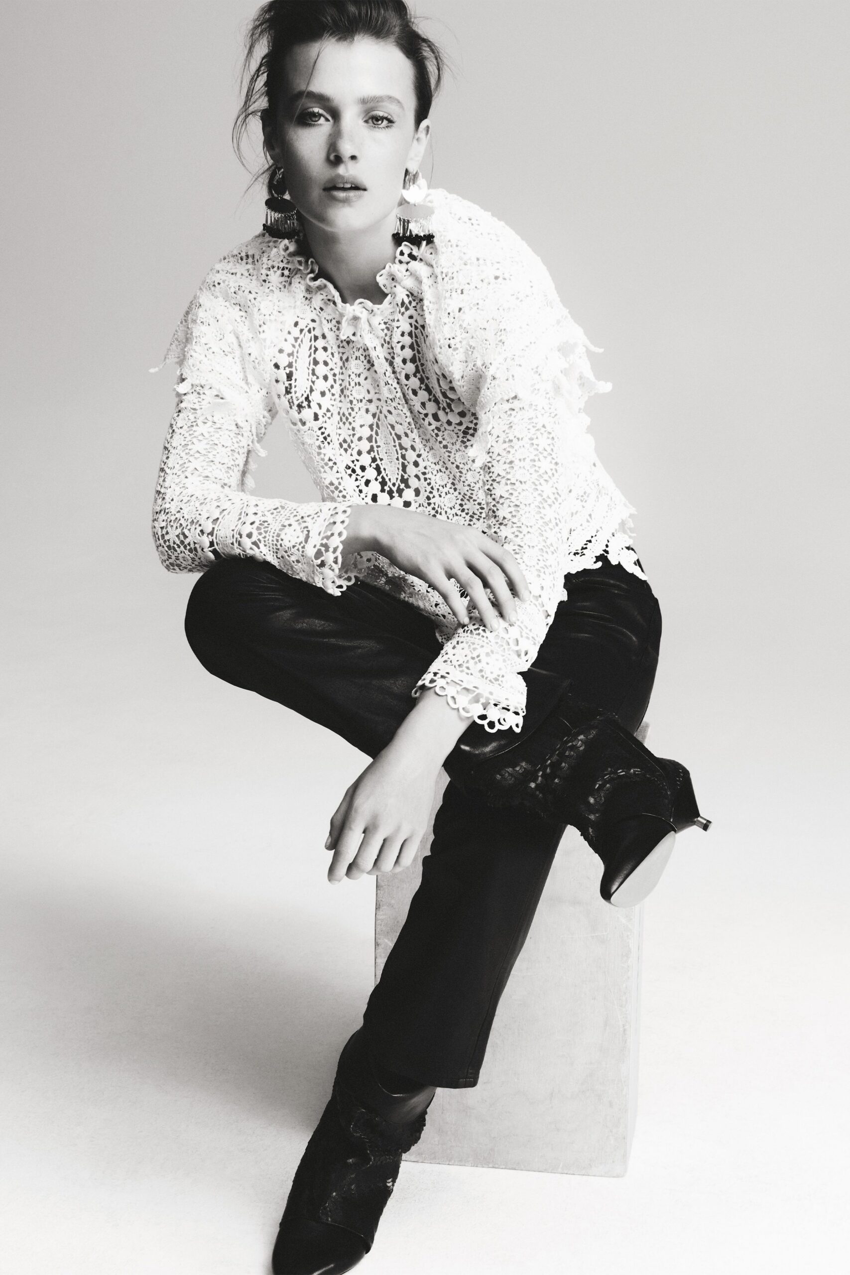 white lace fitted top with black pants