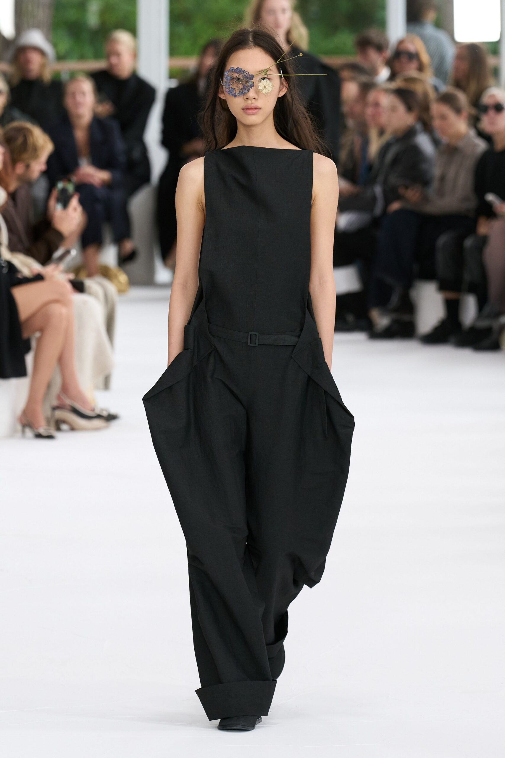 black relaxed jumpsuit with sunglasses