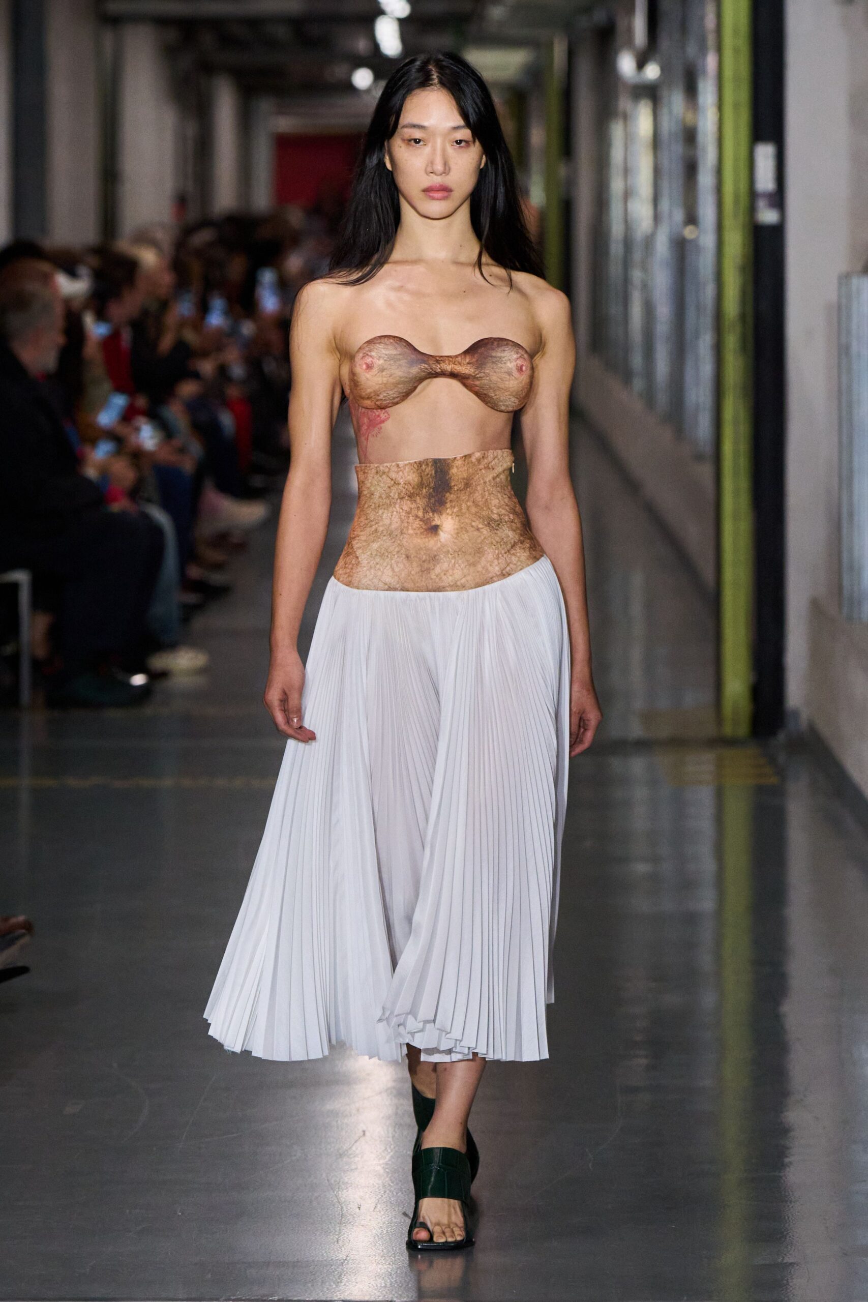 brown silk fitted top with white pleated skirt