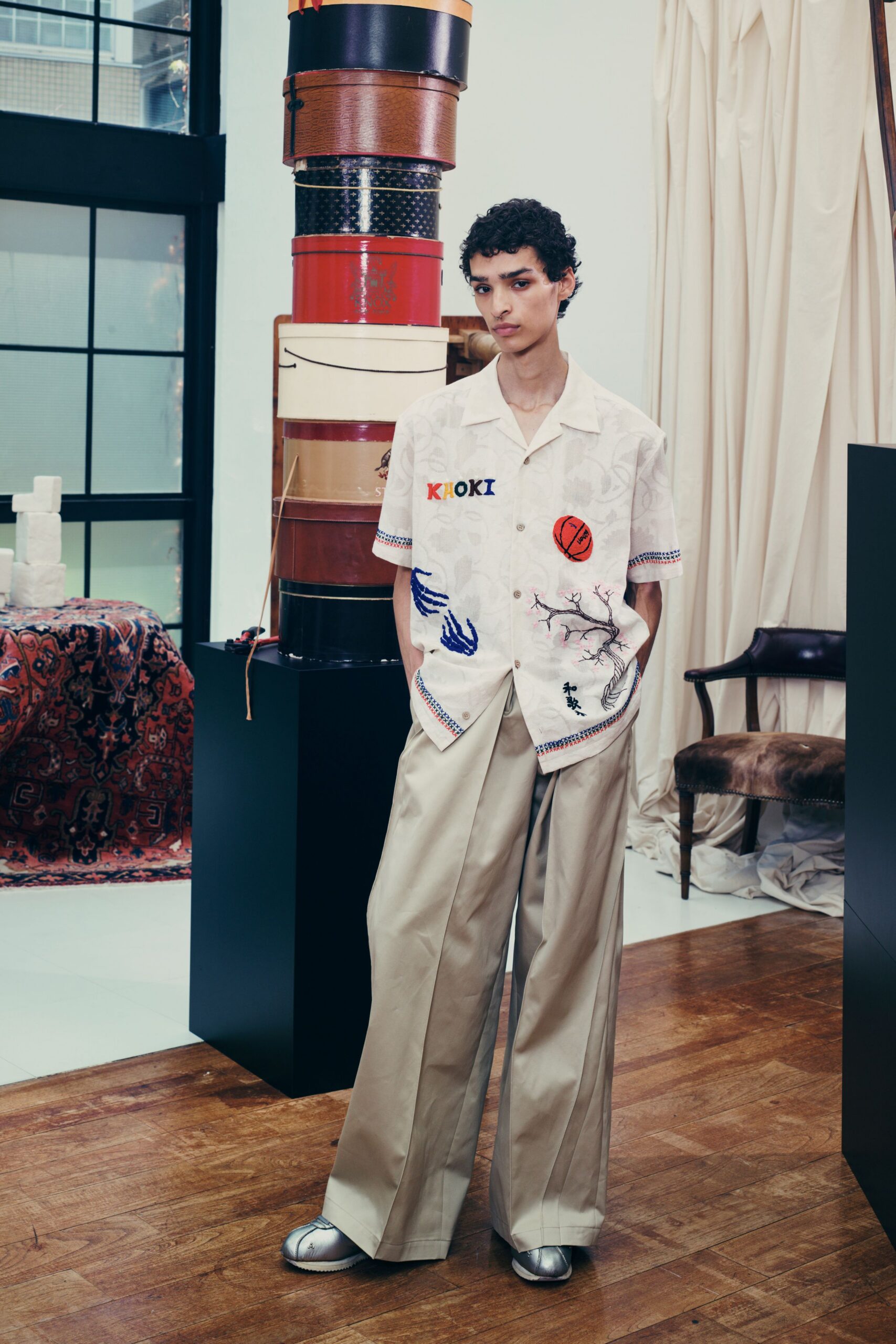 relaxed white embroidered shirt with beige pants