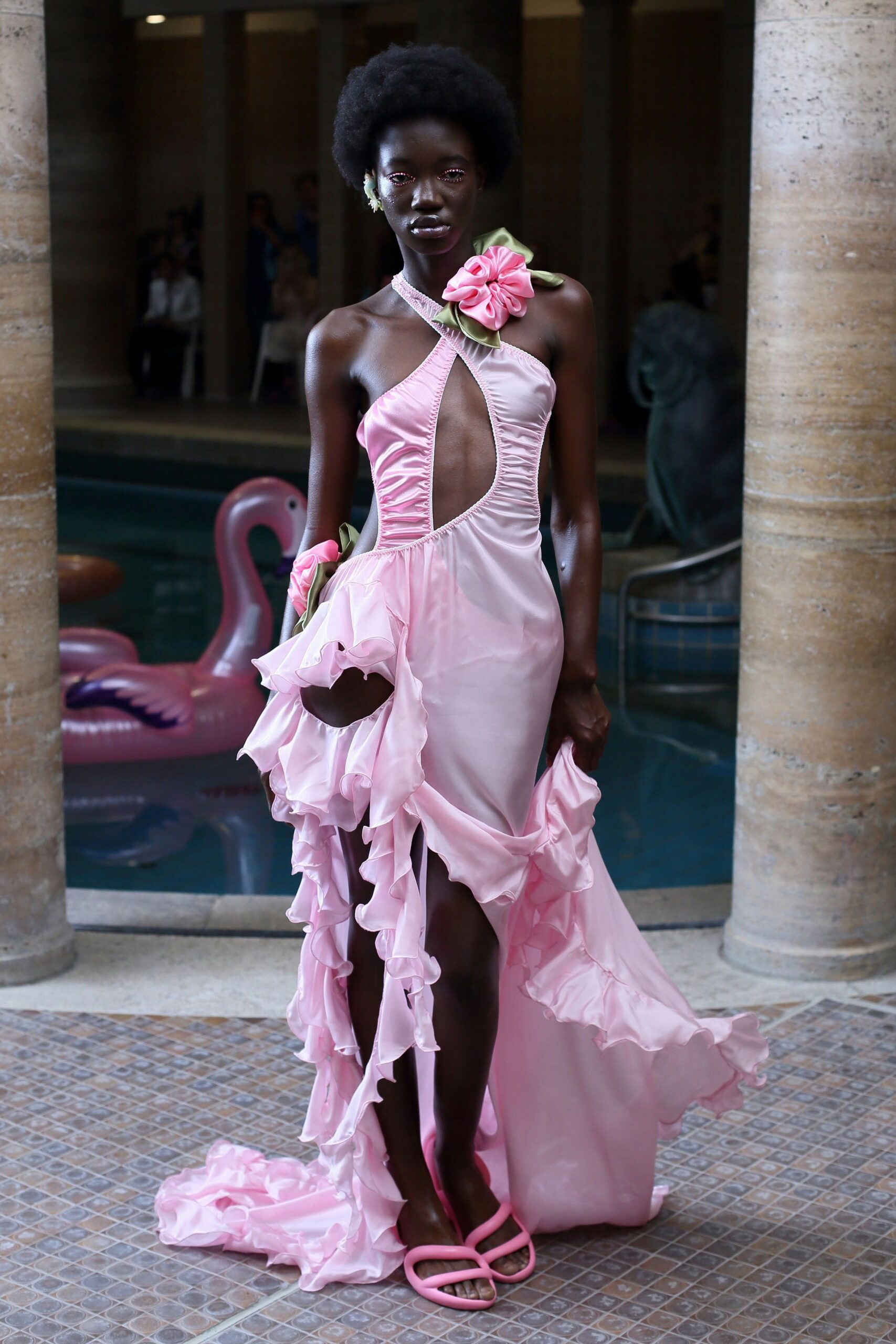 pink silk ruffled gown with strappy shoes
