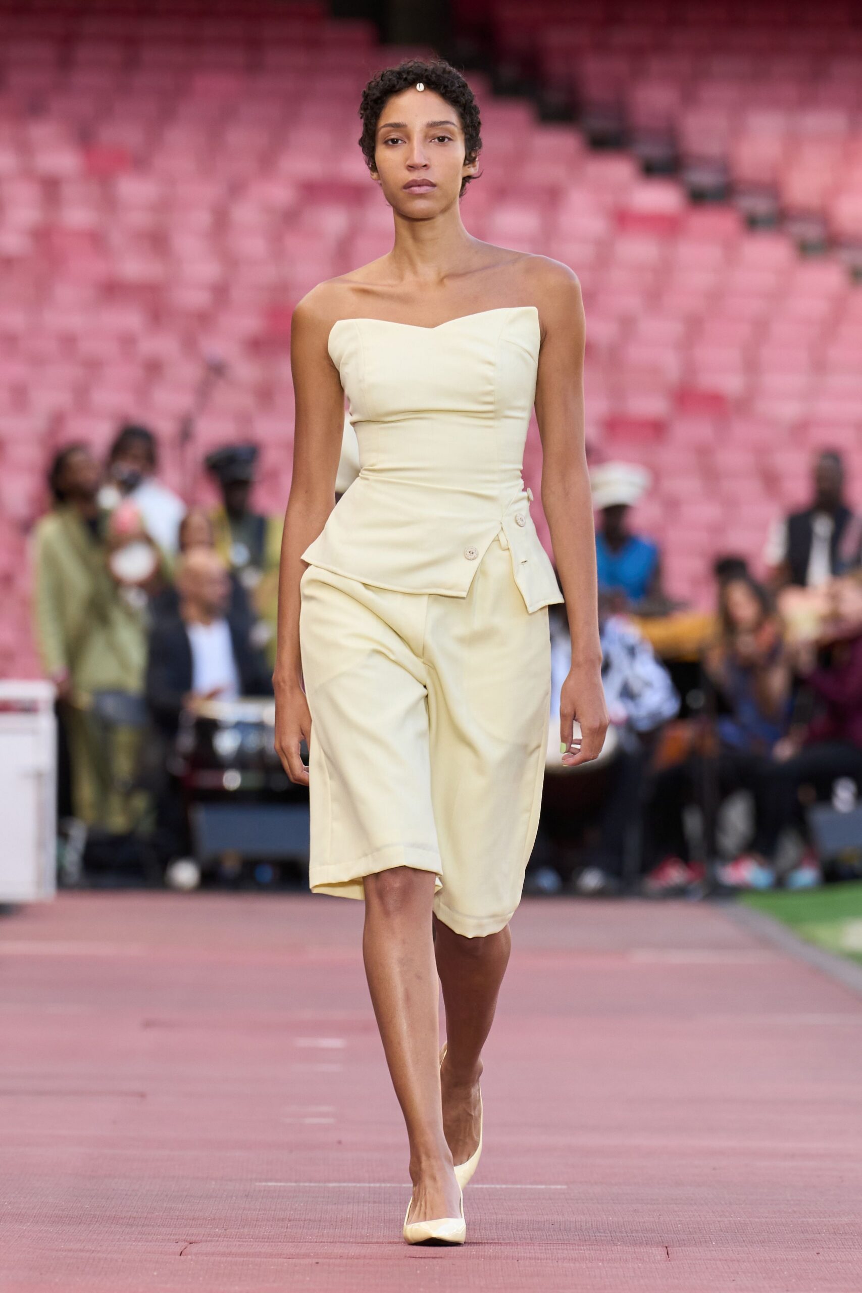 yellow cotton sleeveless v-neck fitted buttoned draped jumpsuit