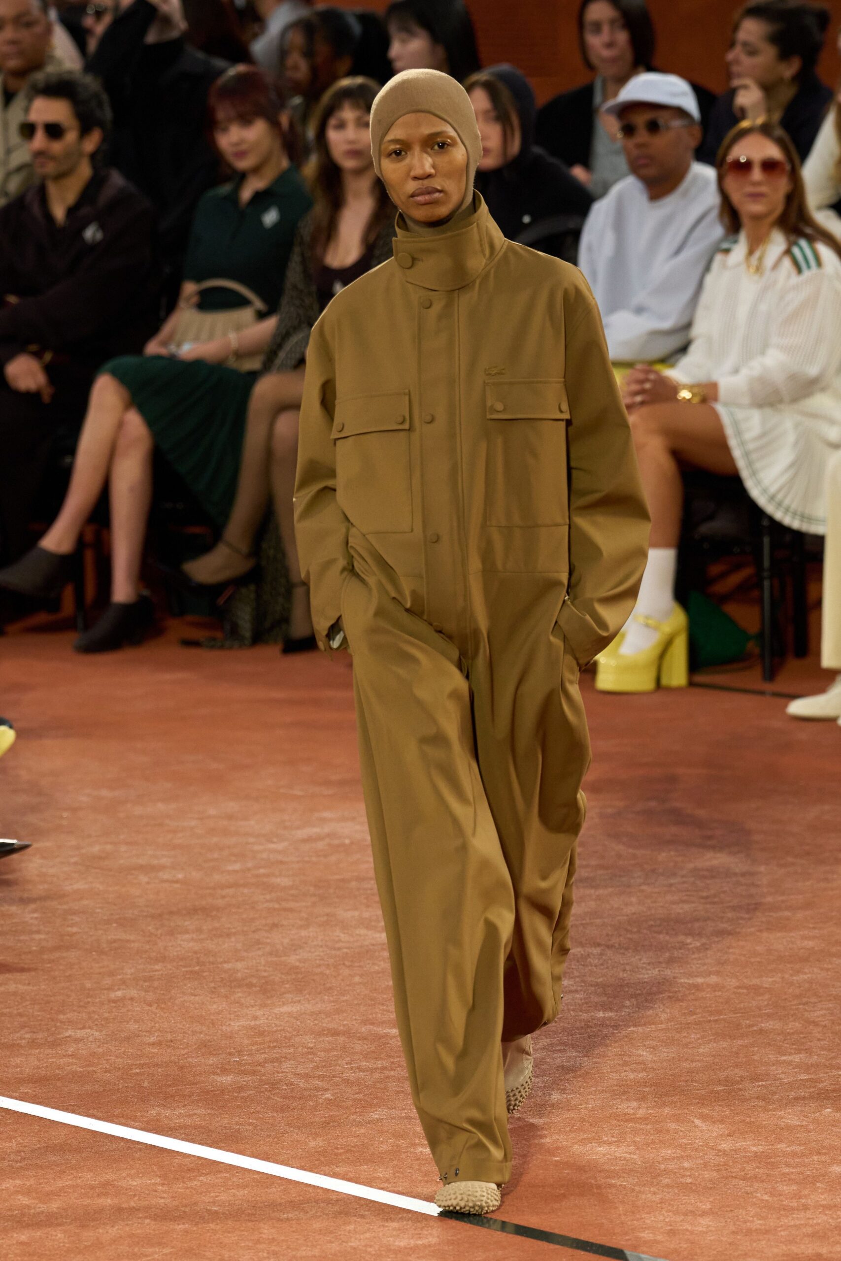 brown relaxed jumpsuit with beige shoes