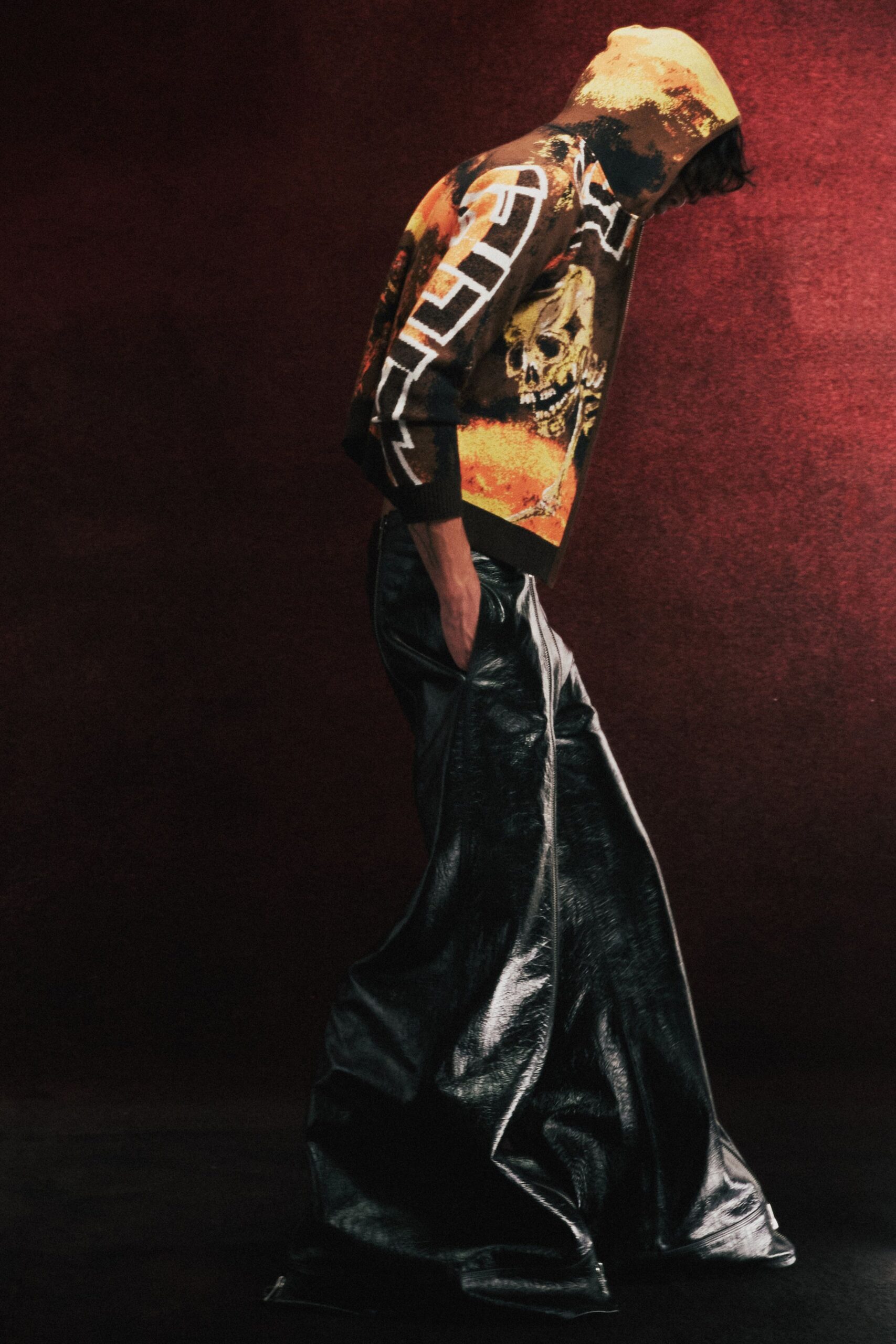black leather wide-leg pants and printed hoodie