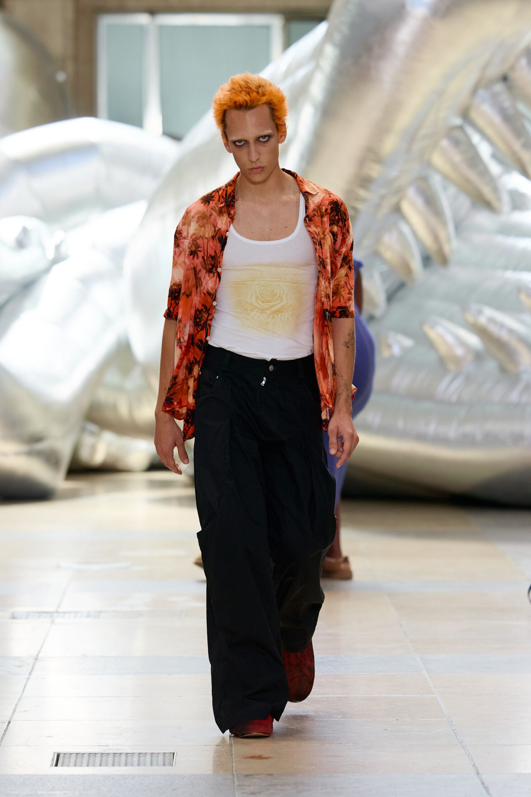 orange floral shirt with black pants