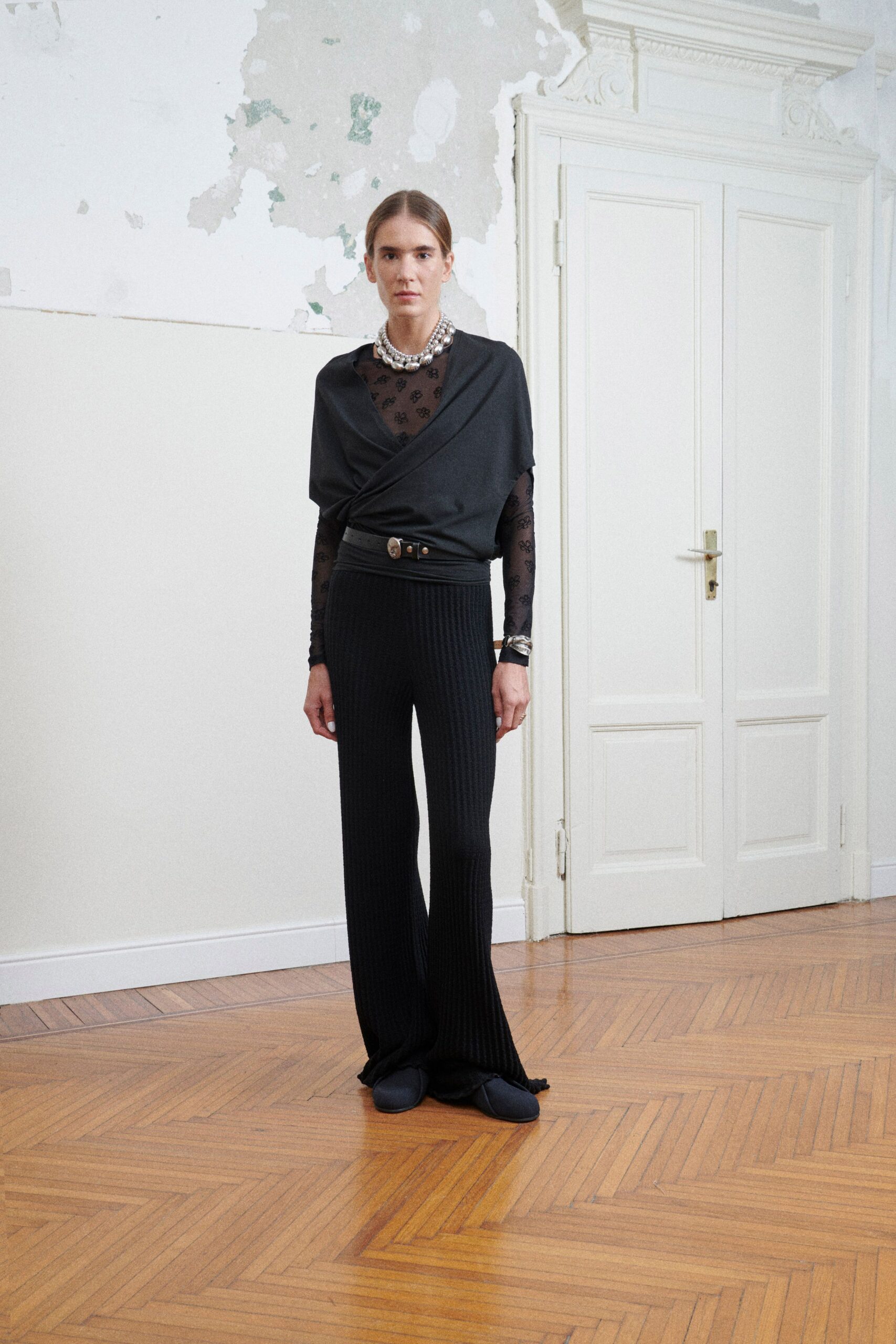 black fitted top and relaxed pants