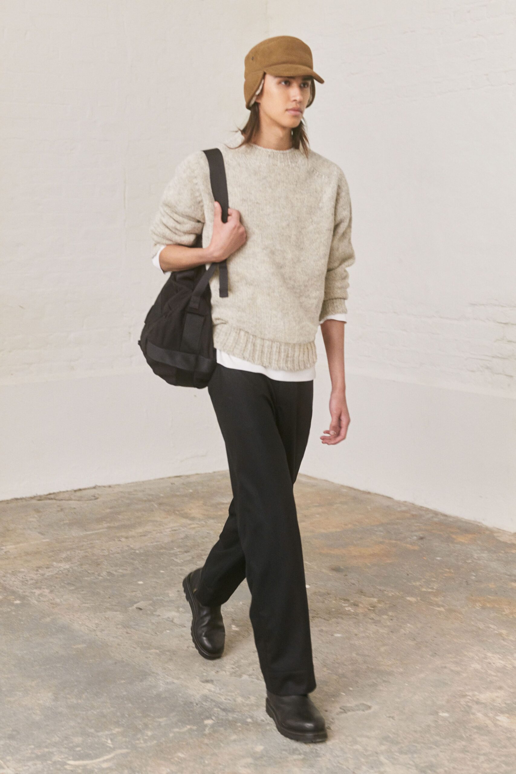 beige wool relaxed sweater with black pants