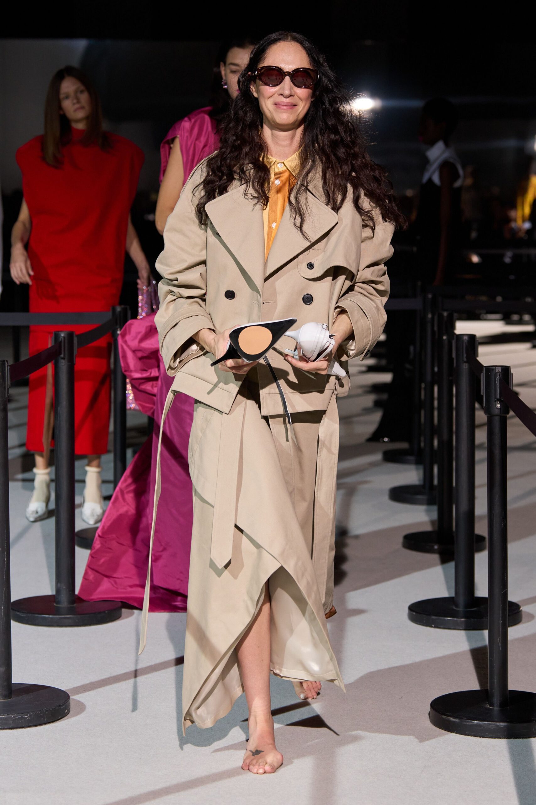 beige trench coat with orange shirt