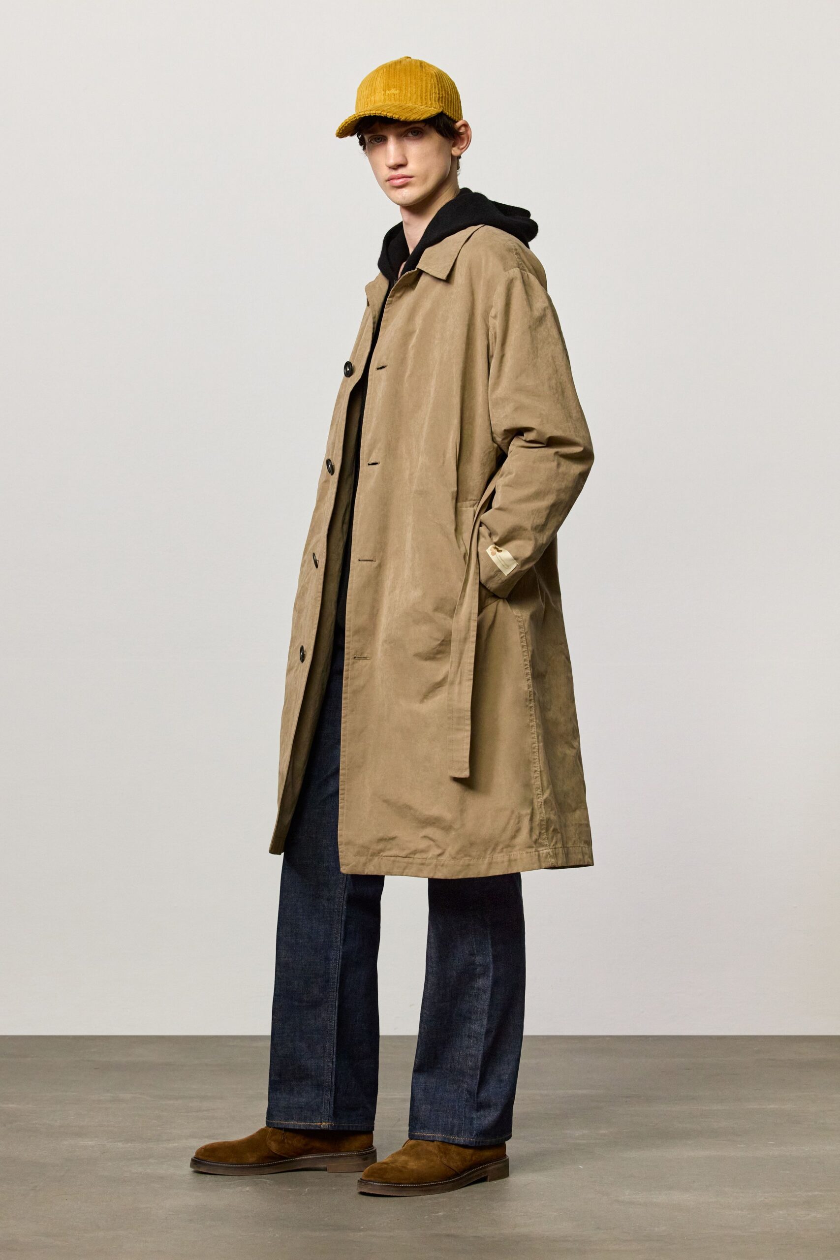 beige coat with black hoodie