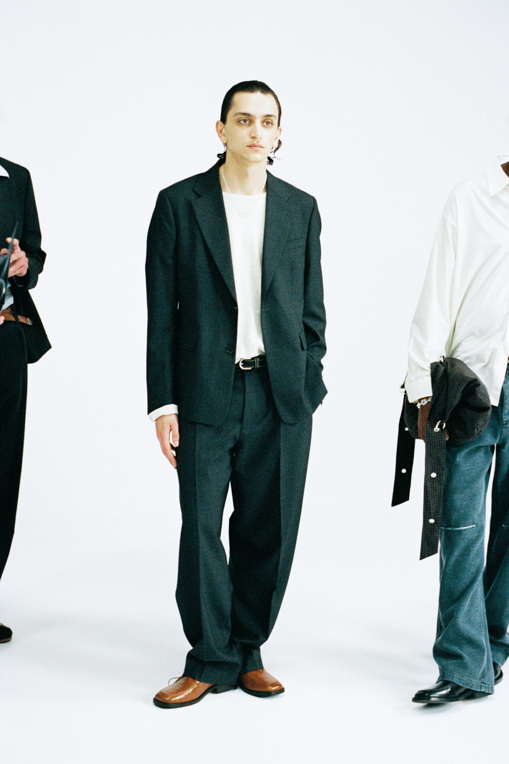 black relaxed suit with brown shoes