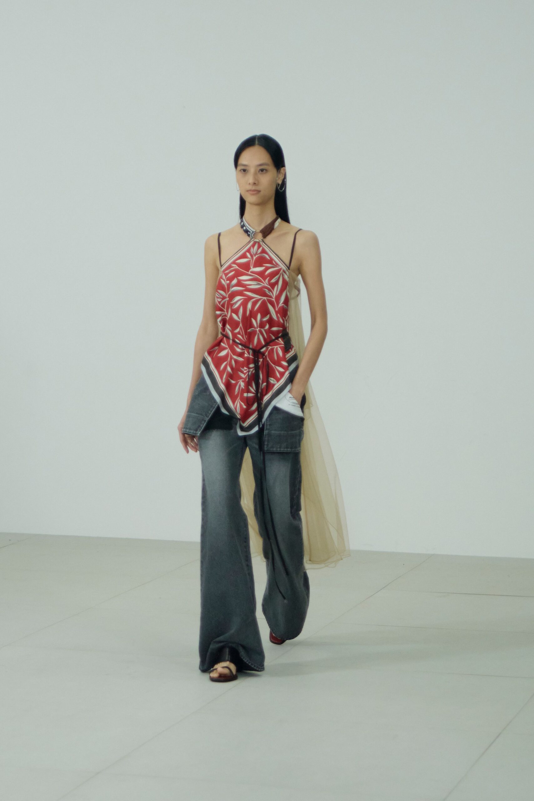 red printed top with gray pants
