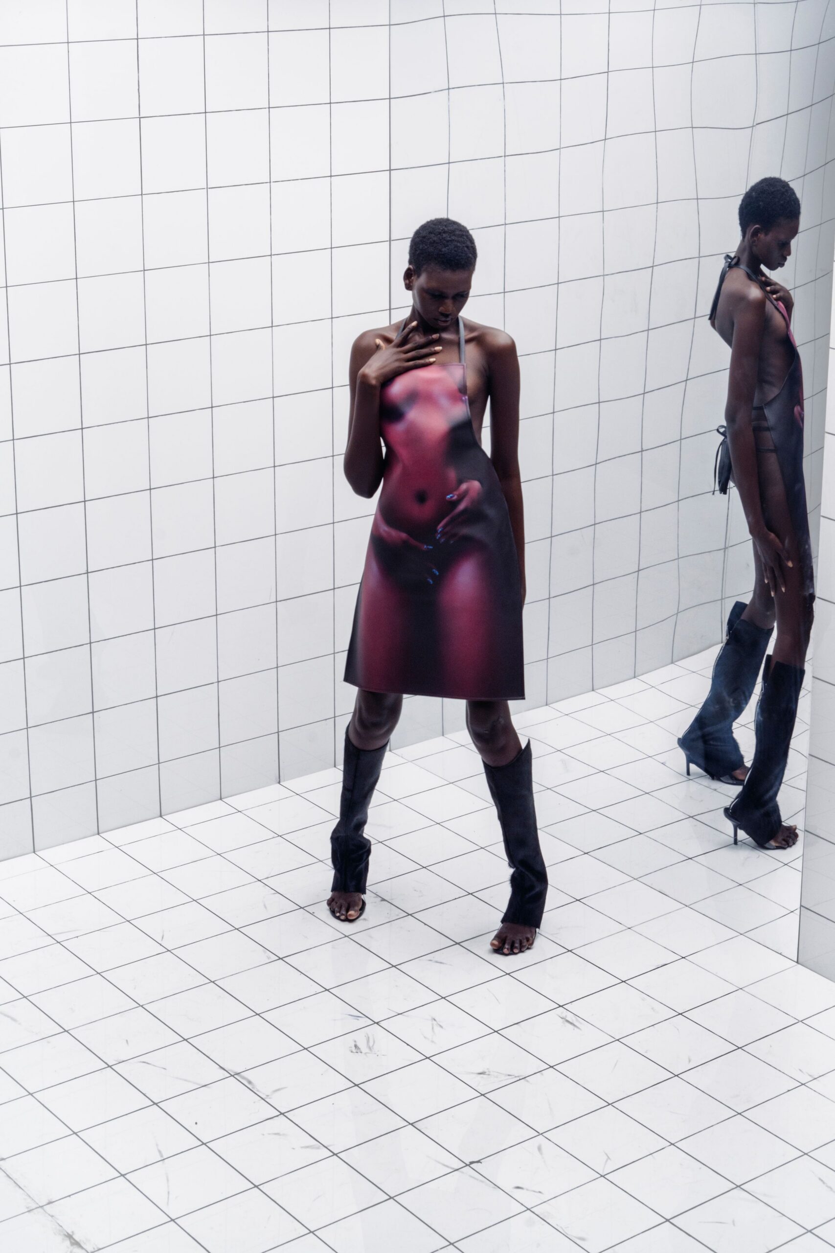 red and black printed mini dress with fitted boots