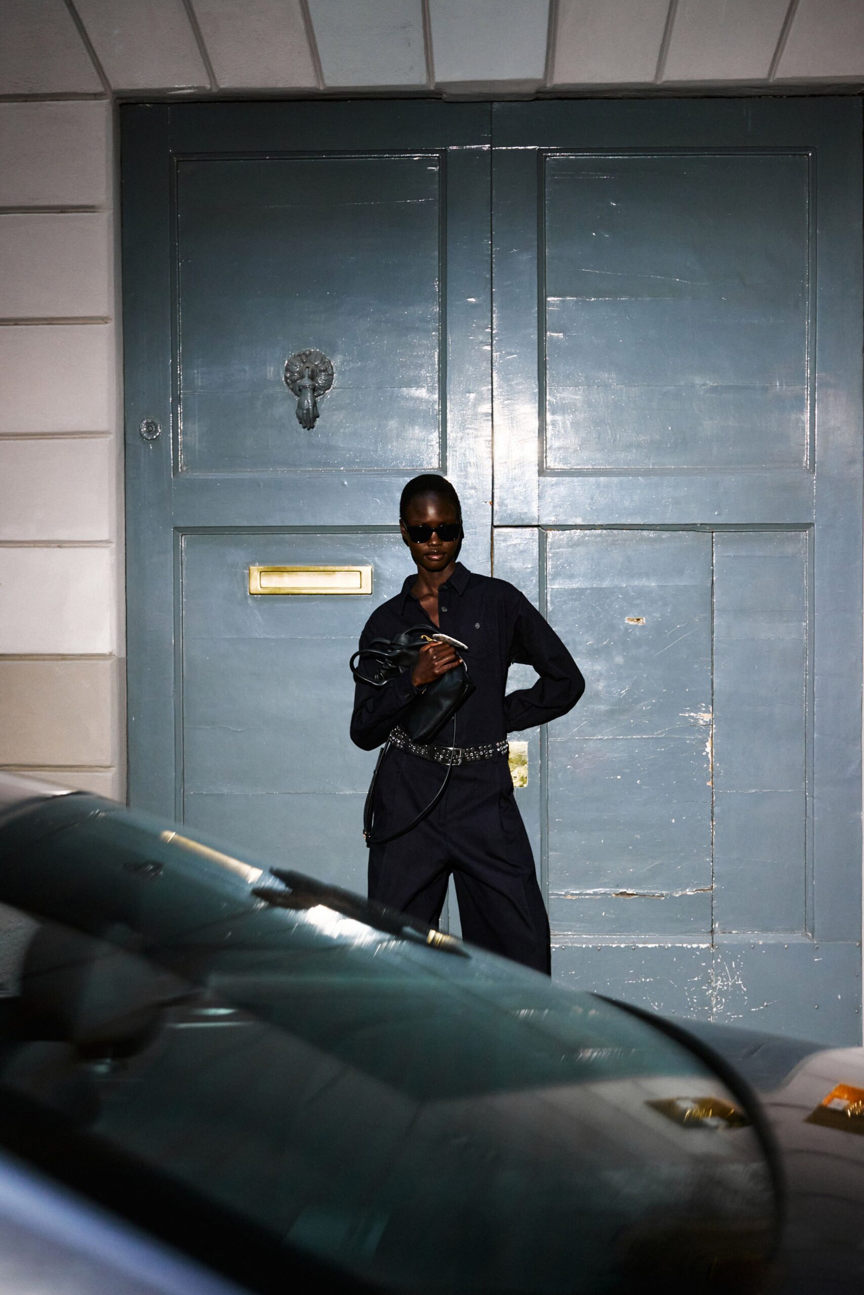 black fitted jumpsuit with accessories
