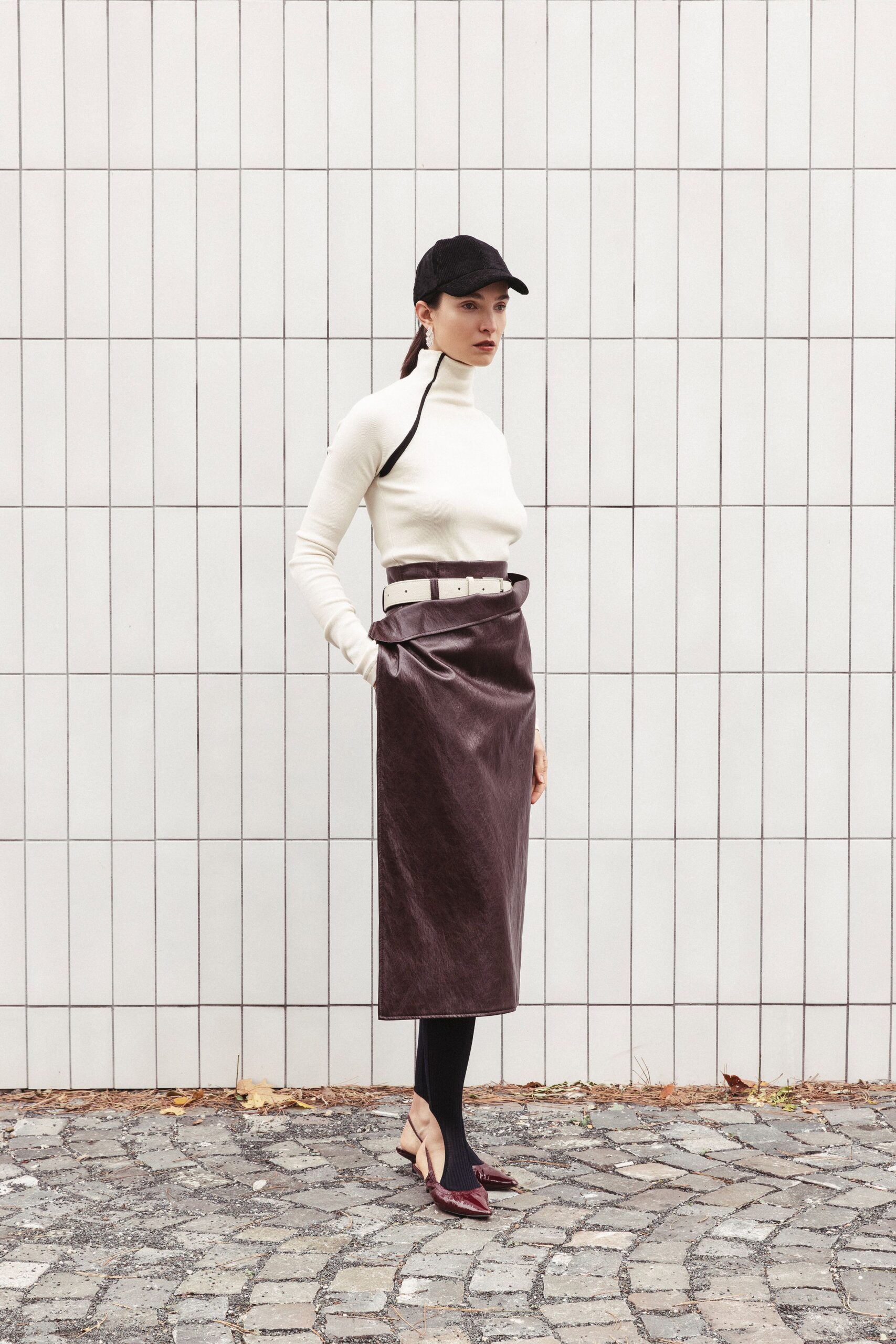 white fitted turtleneck top with brown leather pencil skirt