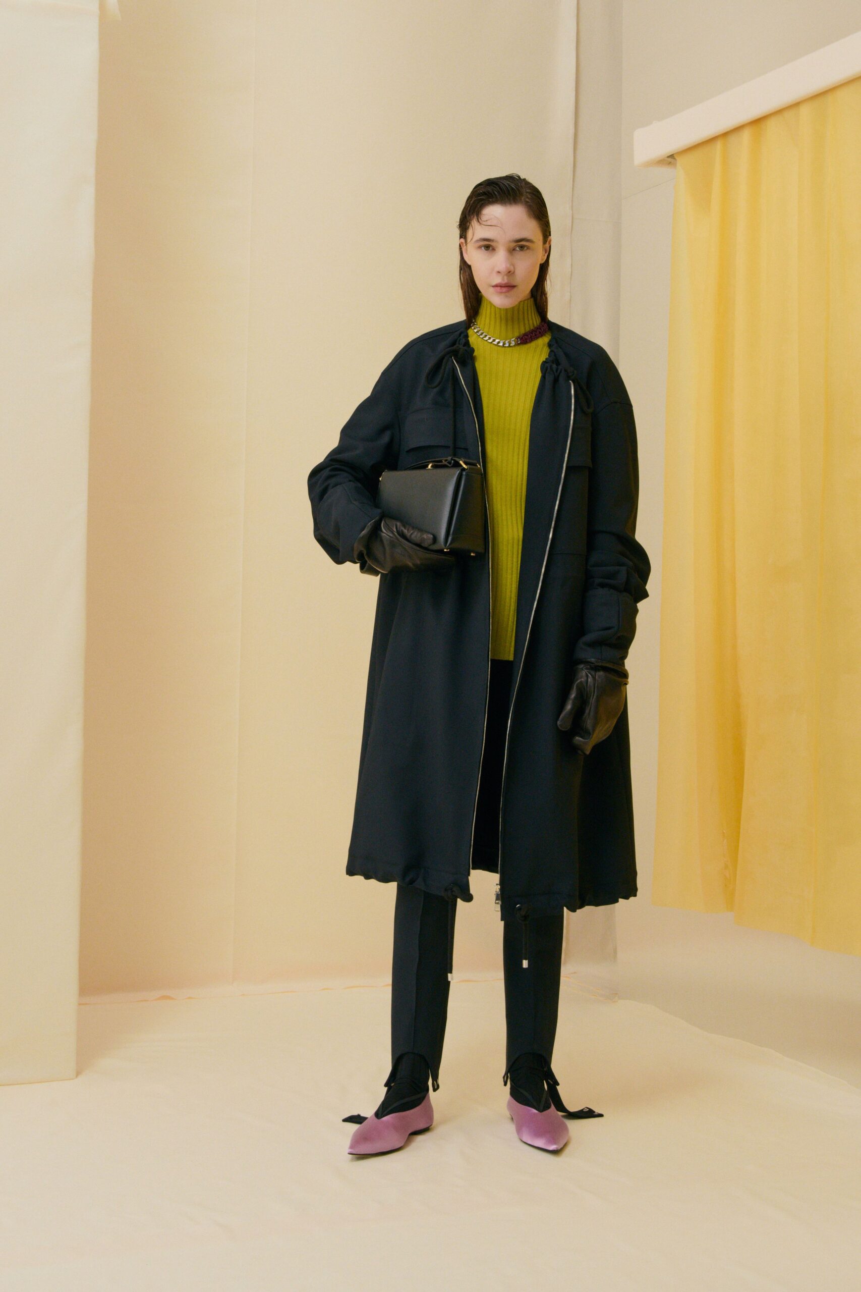 black coat green turtleneck outfit