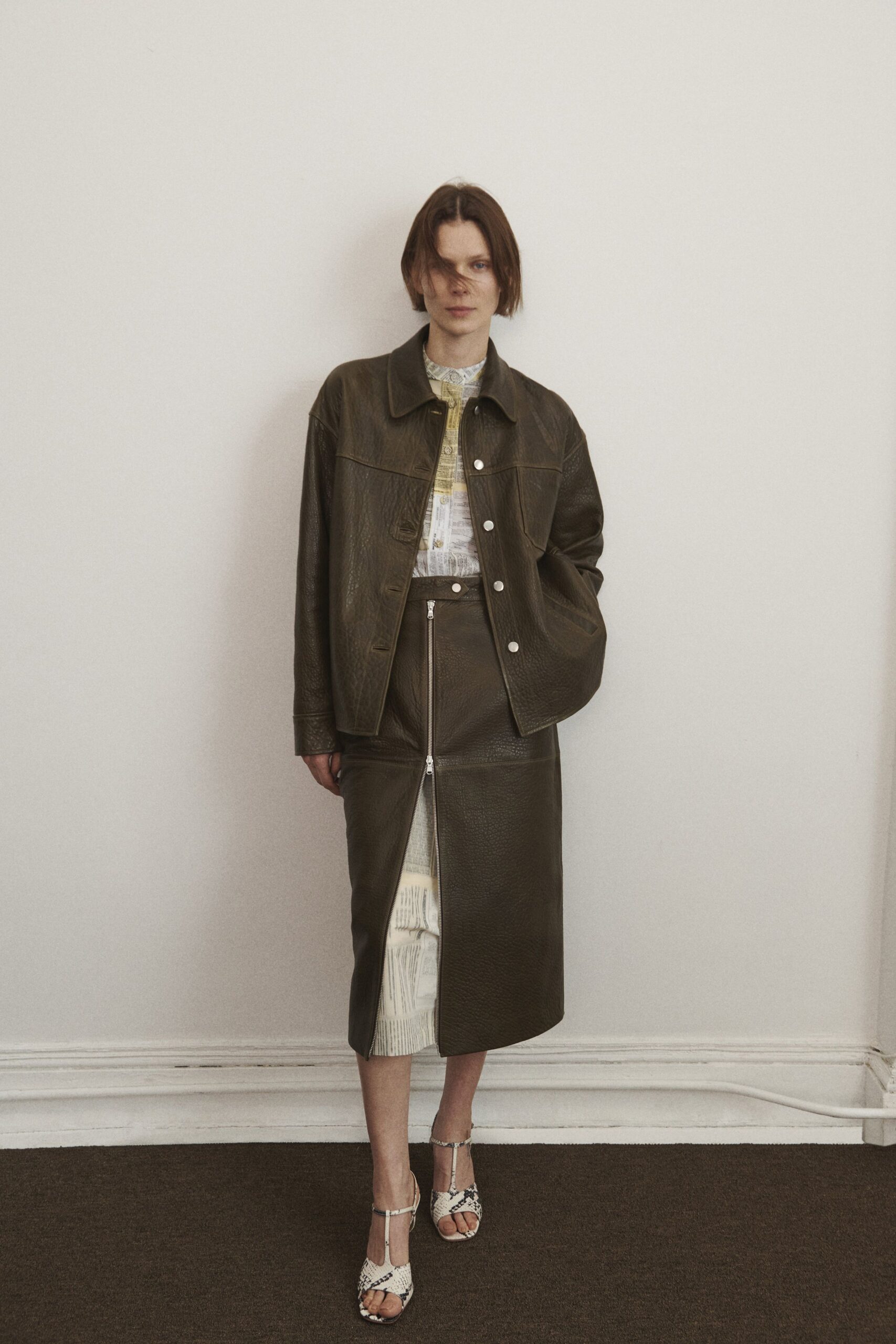 brown leather long-sleeve collared relaxed buttoned jacket