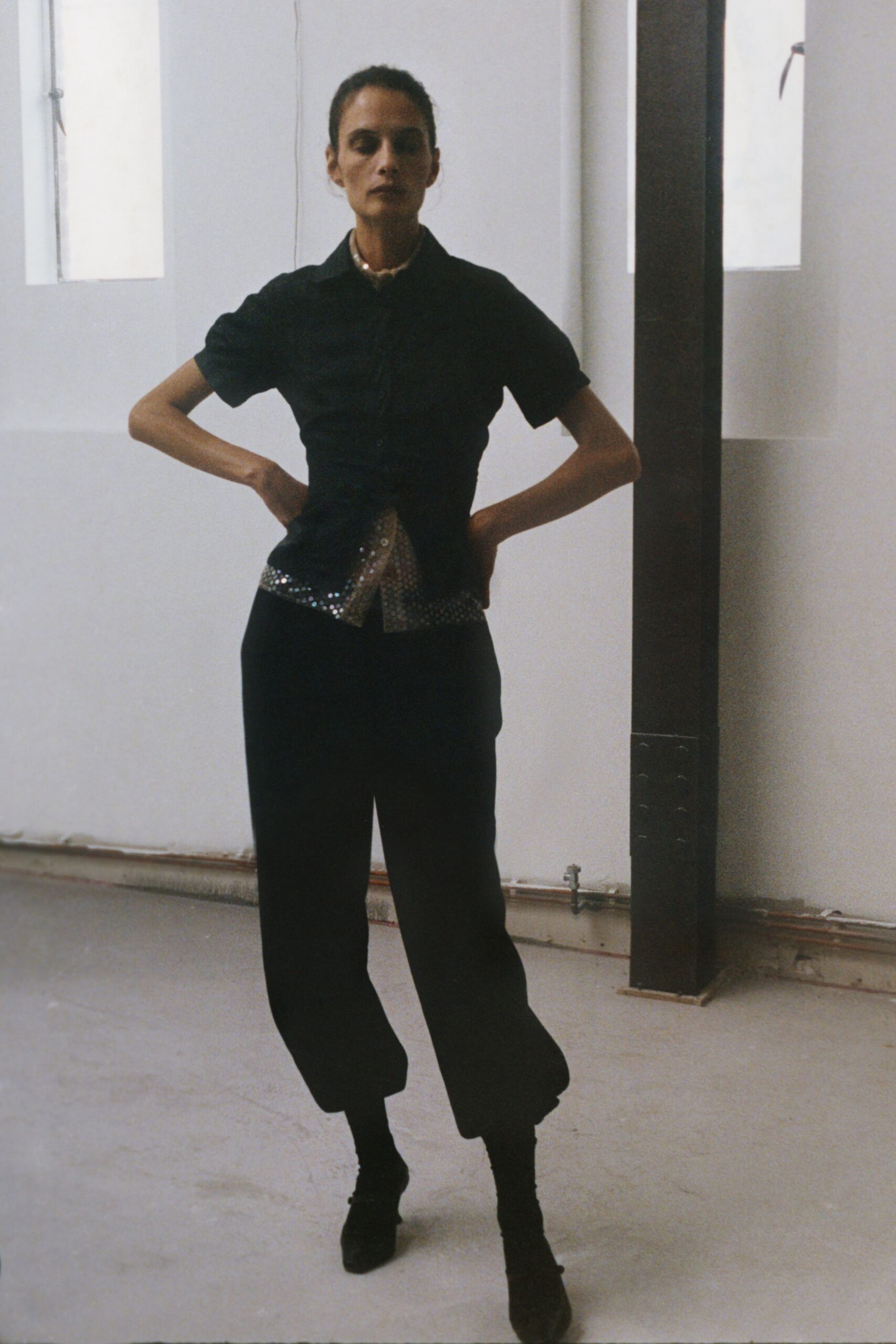 black fitted shirt and relaxed pants