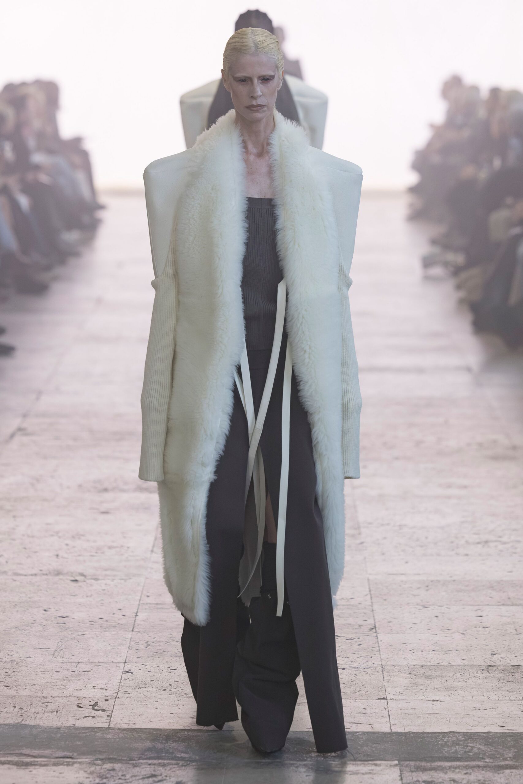 black silk gown with oversized white coat