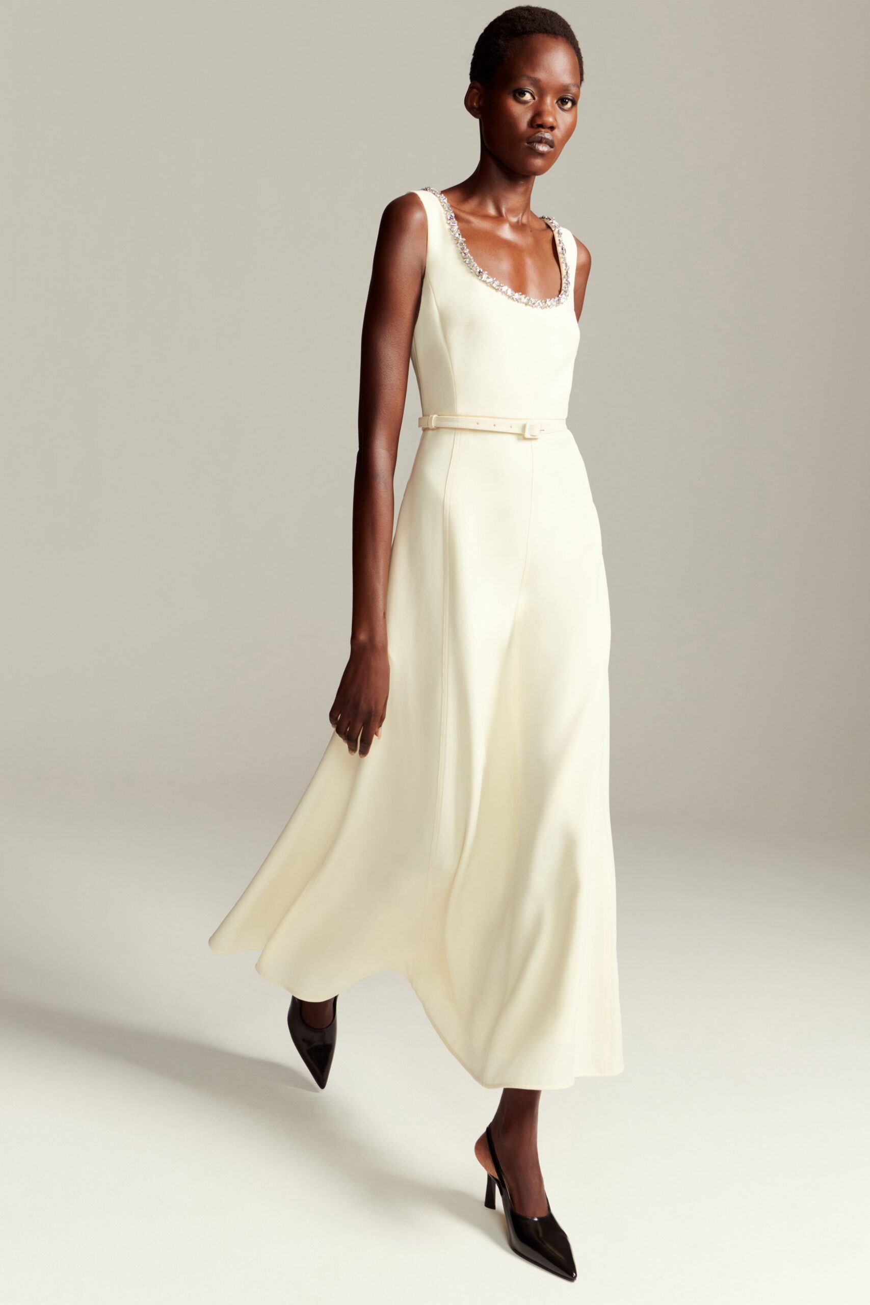 ivory silk sleeveless square-neck fitted belted flowing gown