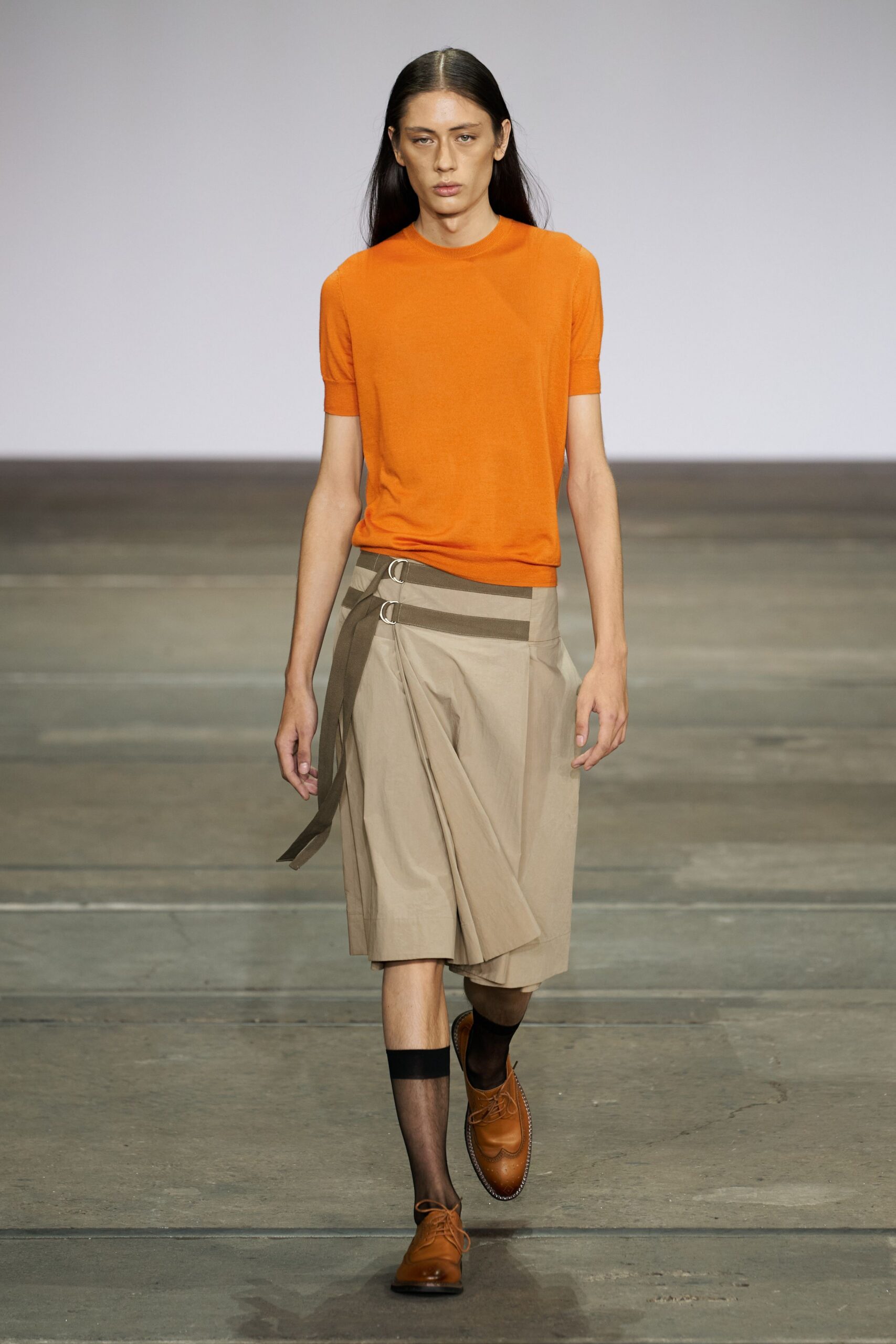 orange fitted top beige pleated skirt
