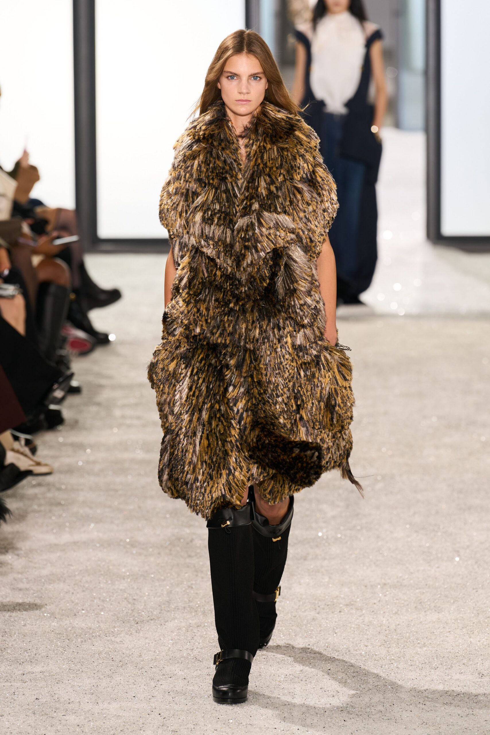 brown fur relaxed coat with black boots