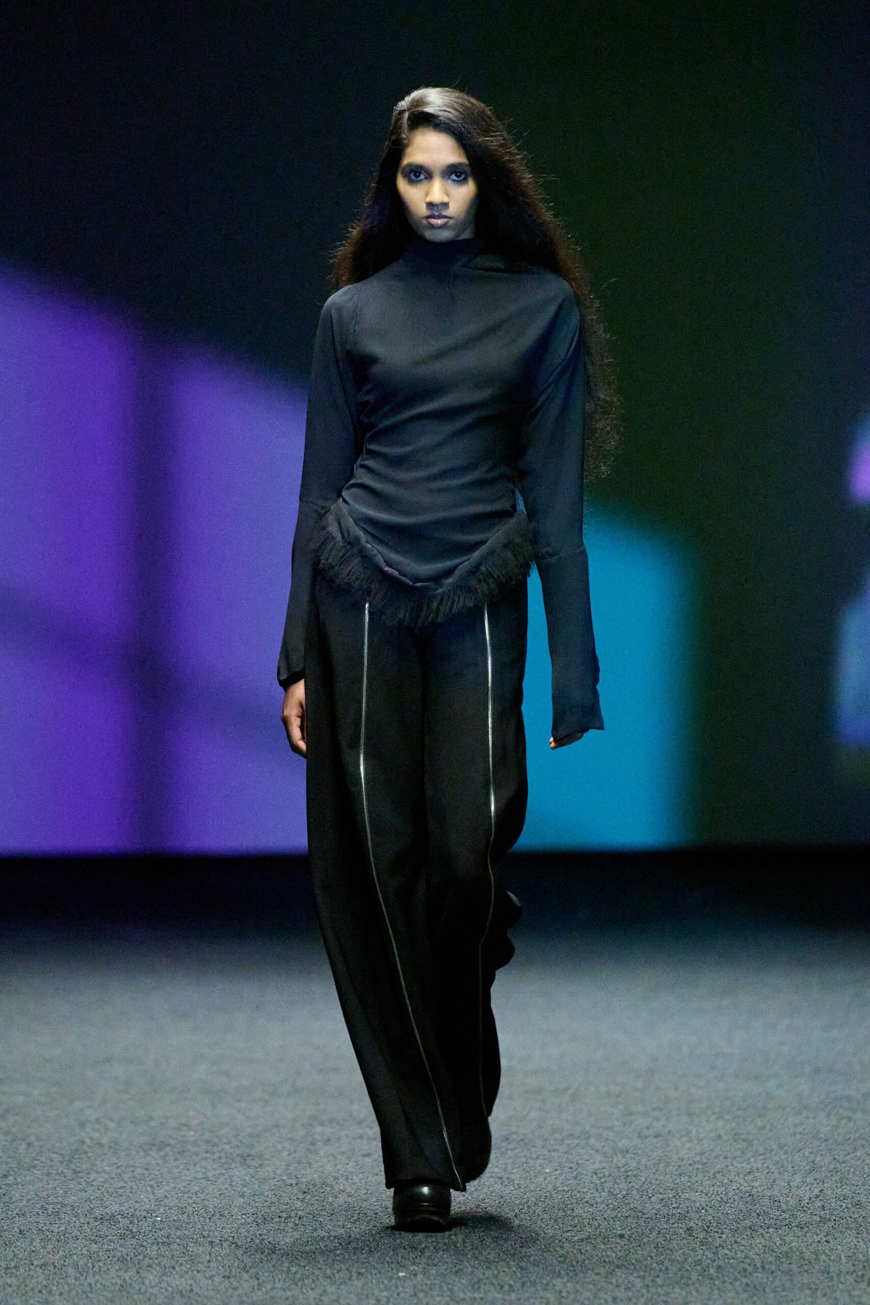 black fitted top with fringed detail