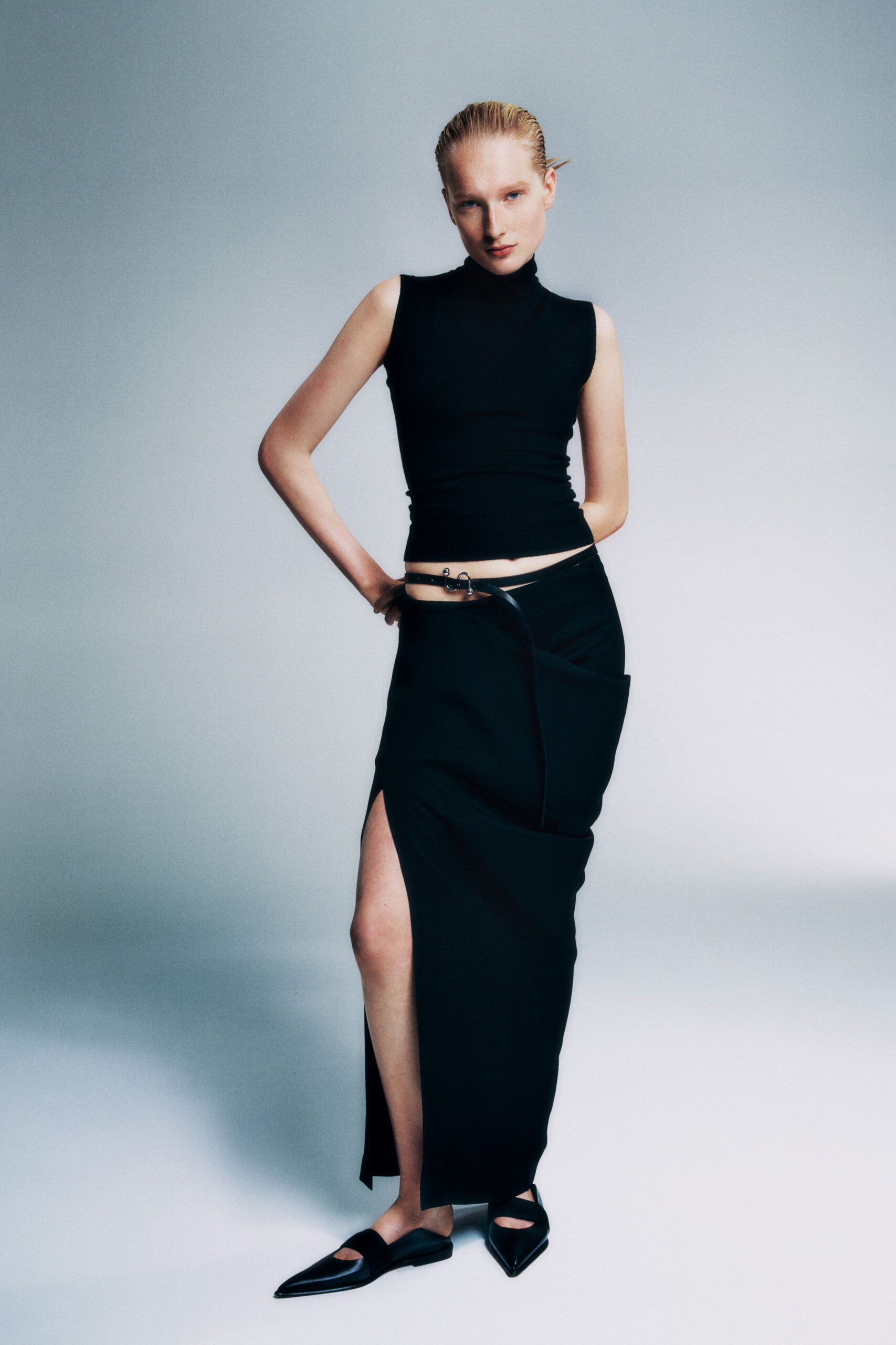 black cotton sleeveless high-neck fitted top