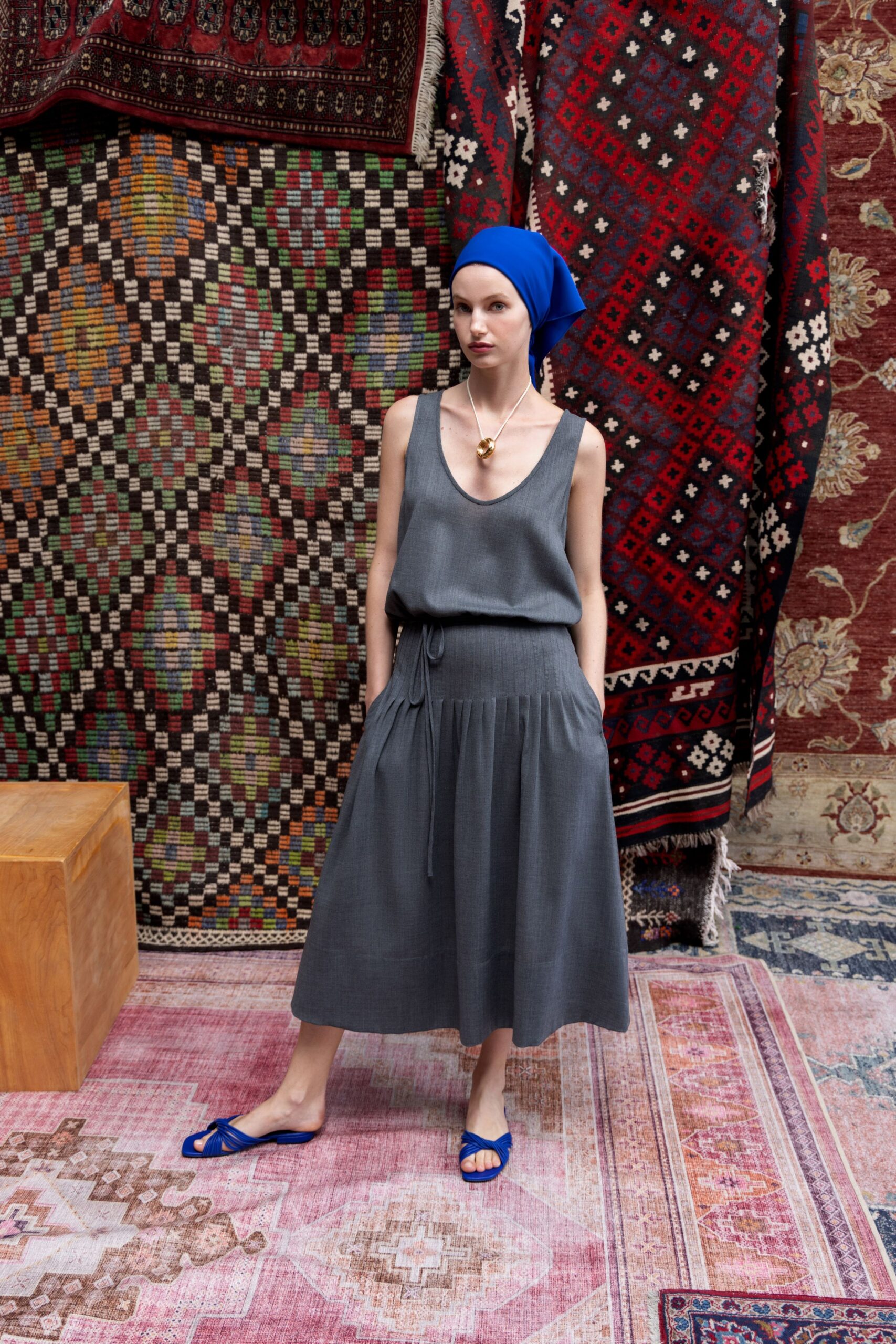 gray relaxed midi dress with blue accessories