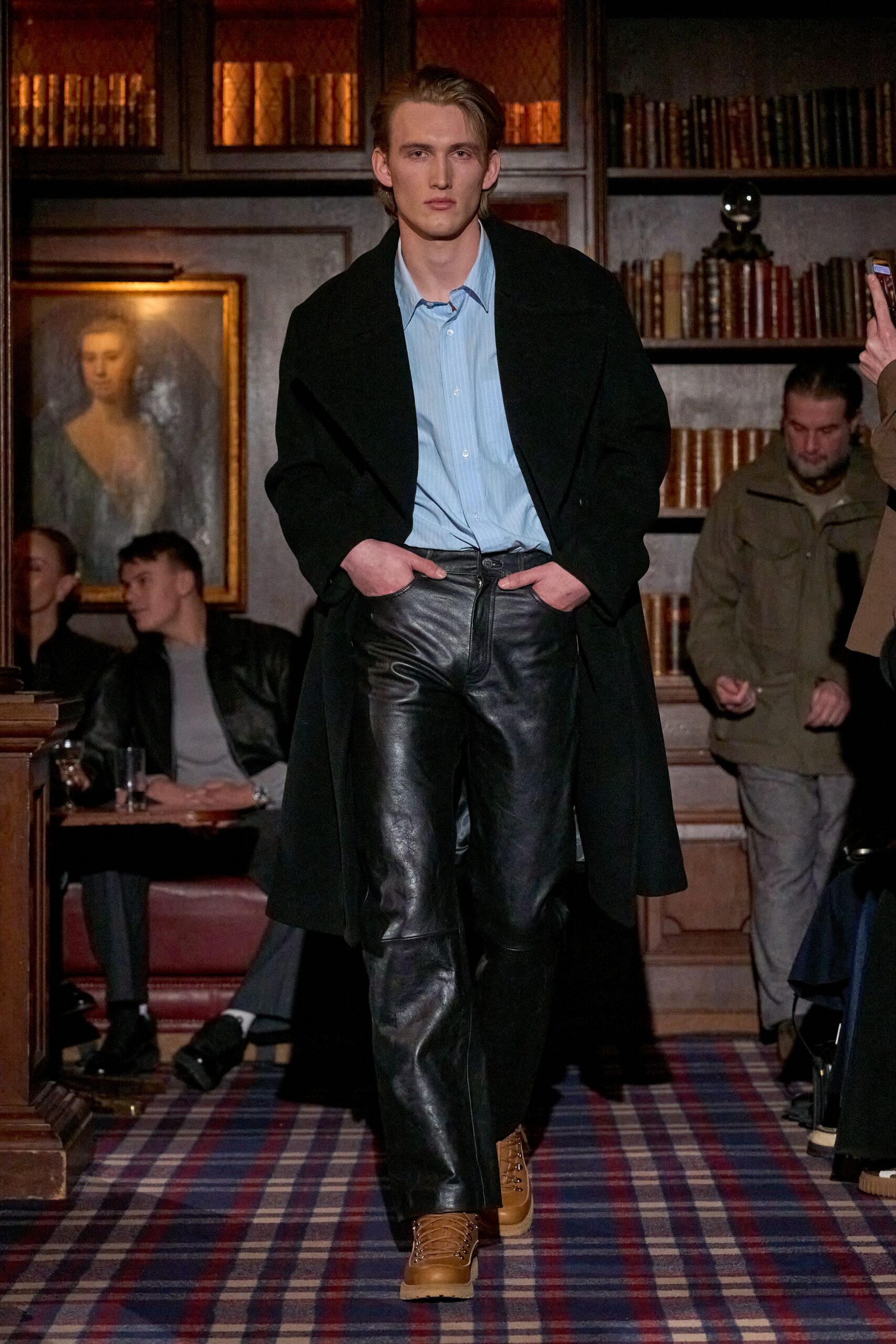 black coat blue shirt leather pants