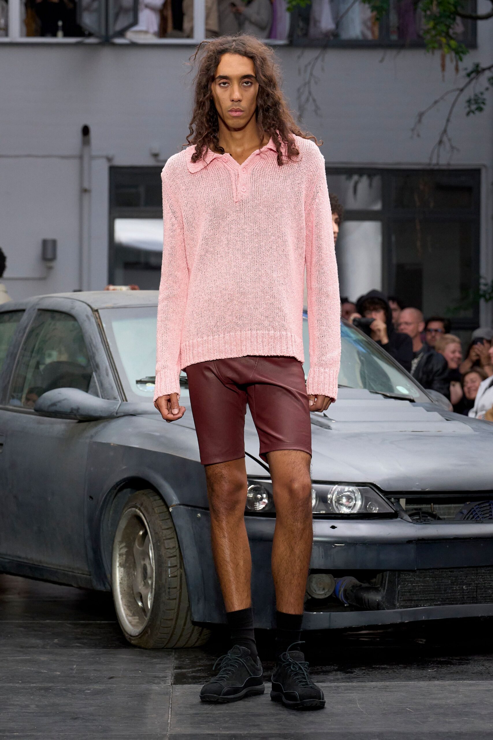 pink relaxed sweater with brown shorts