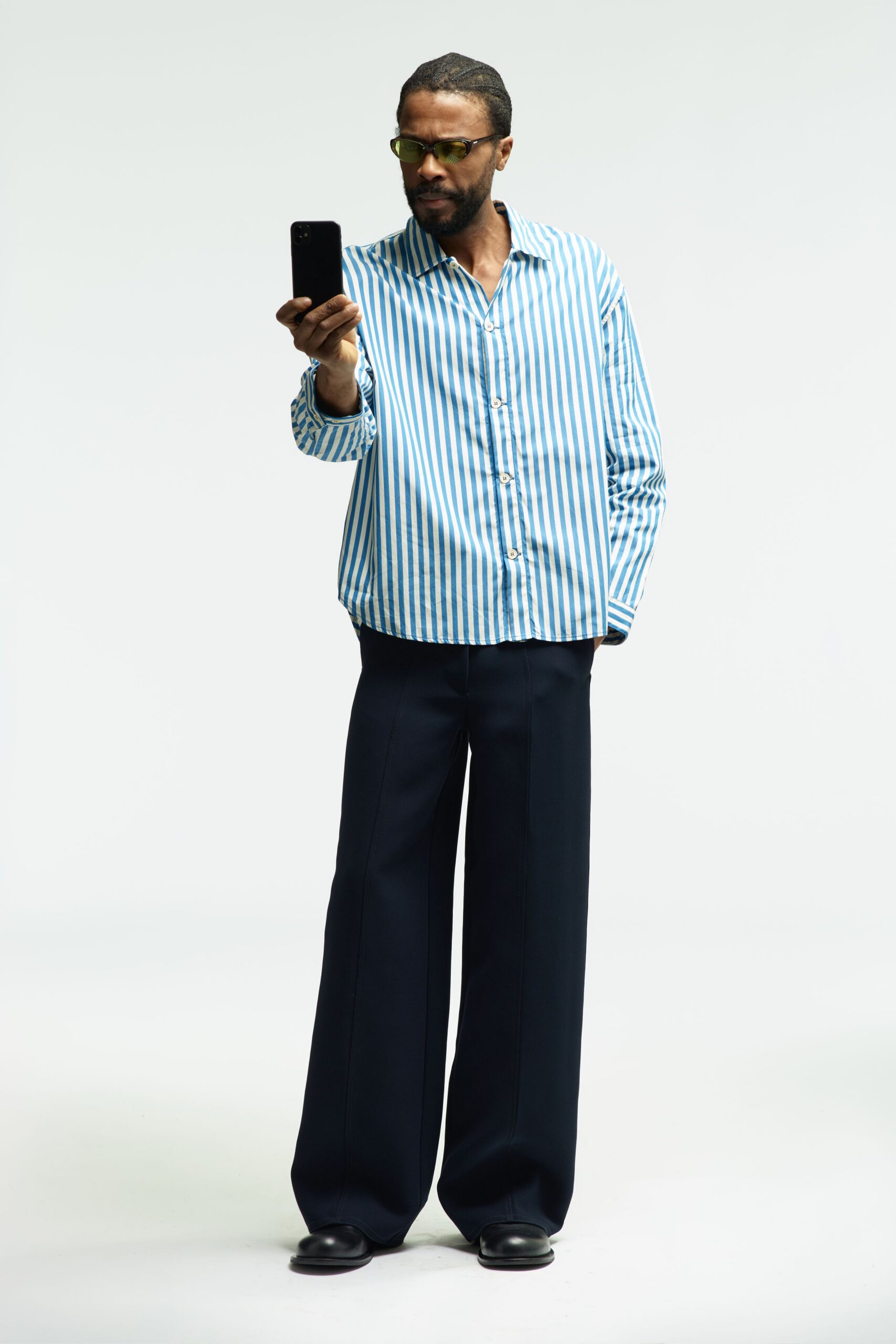 blue striped shirt black pants
