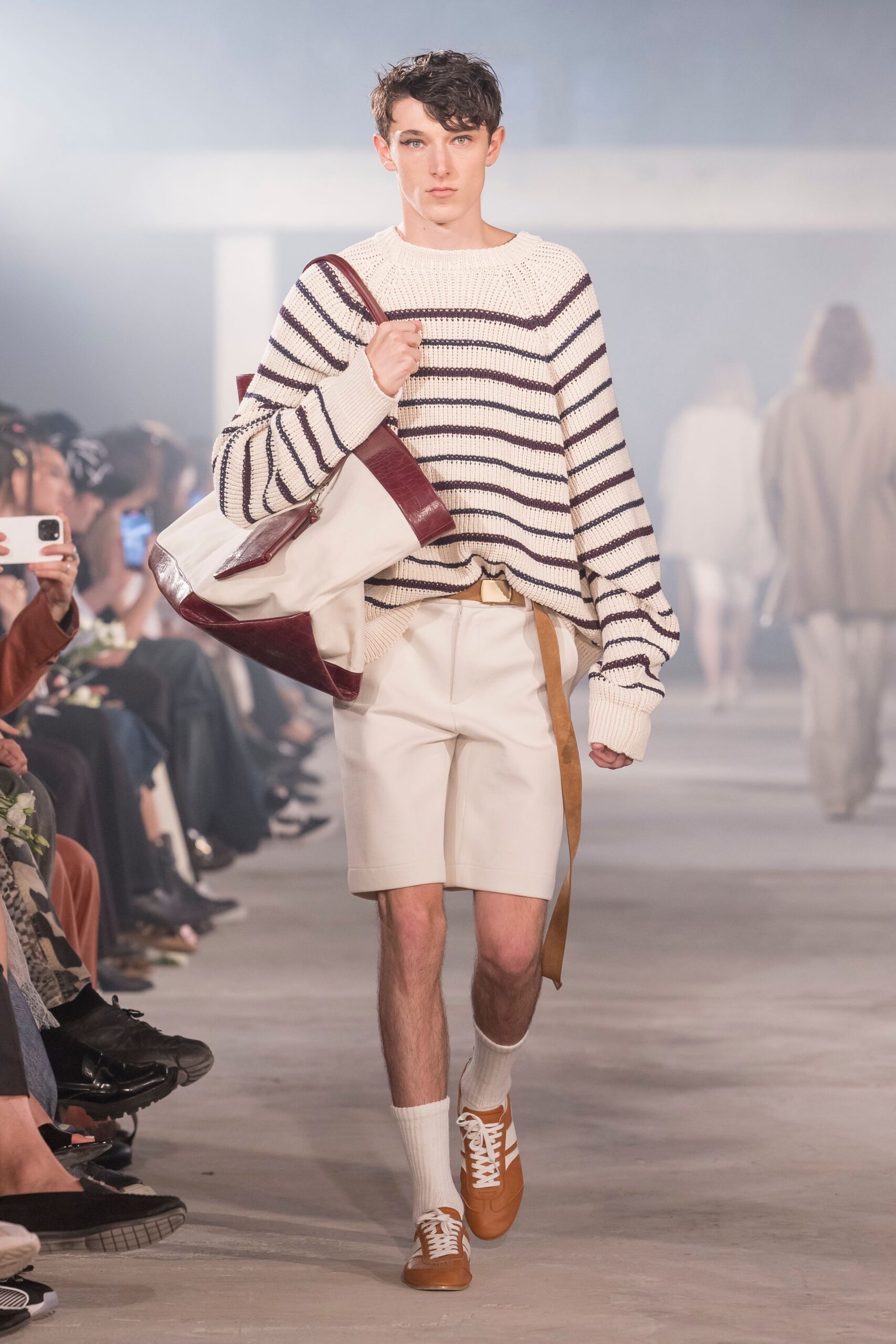 striped sweater and beige shorts
