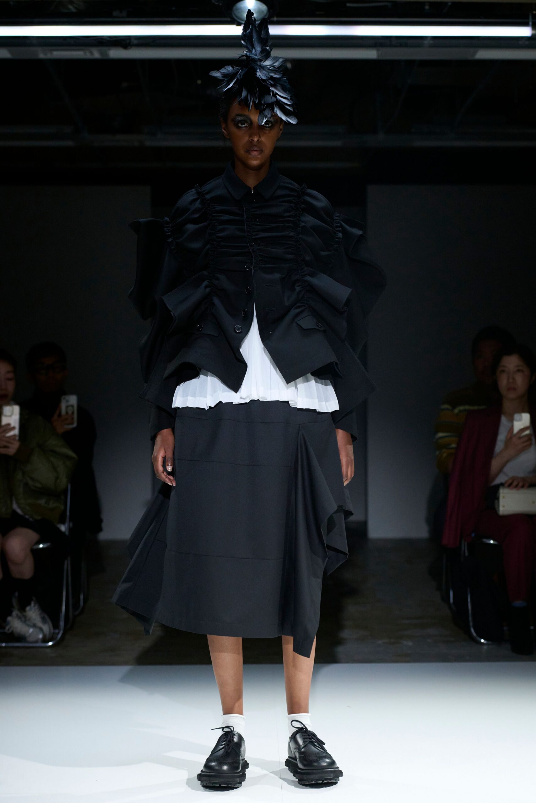 black structured jacket with white blouse