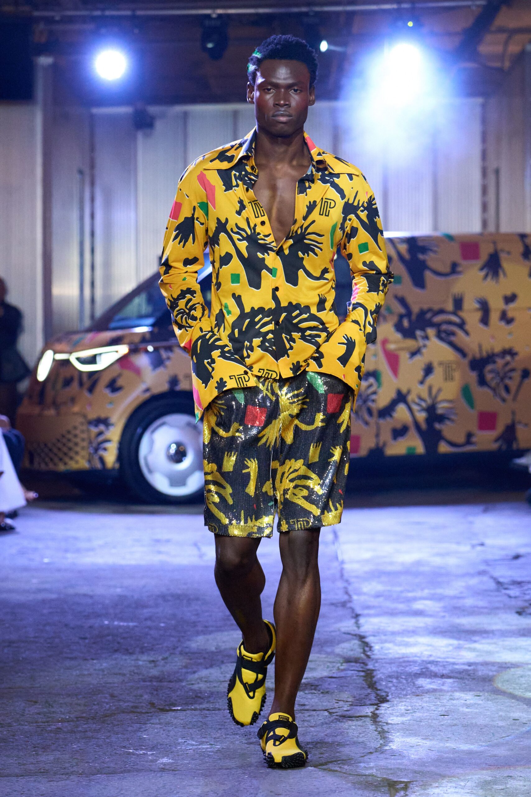 yellow printed shirt with sequined shorts