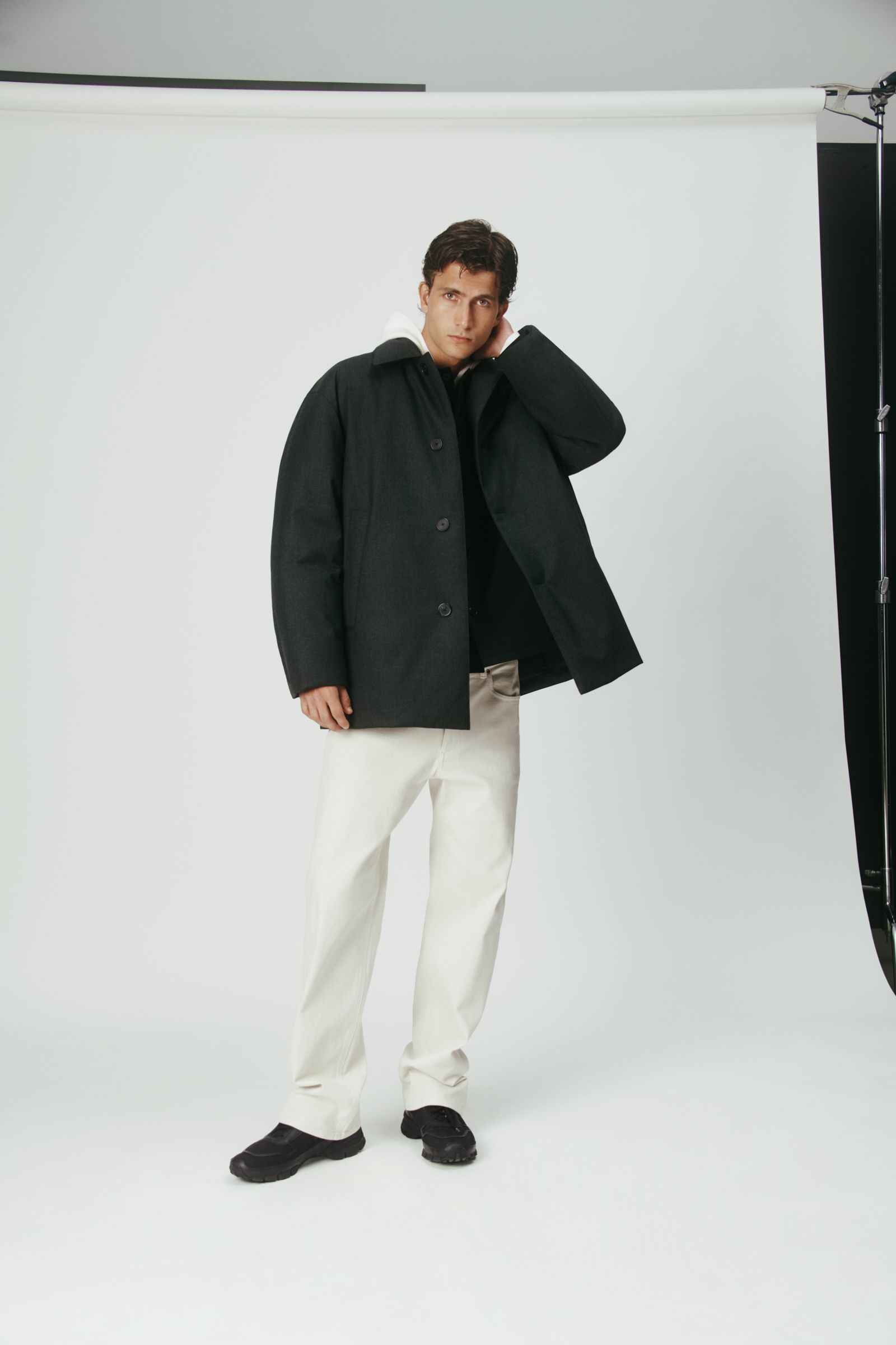 black wool long-sleeve collared relaxed buttoned jacket