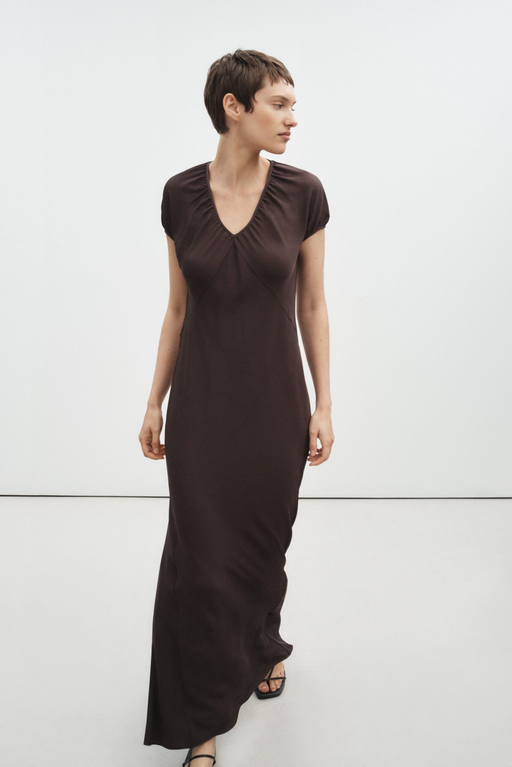 brown jersey short-sleeve v-neck fitted draped maxi gown