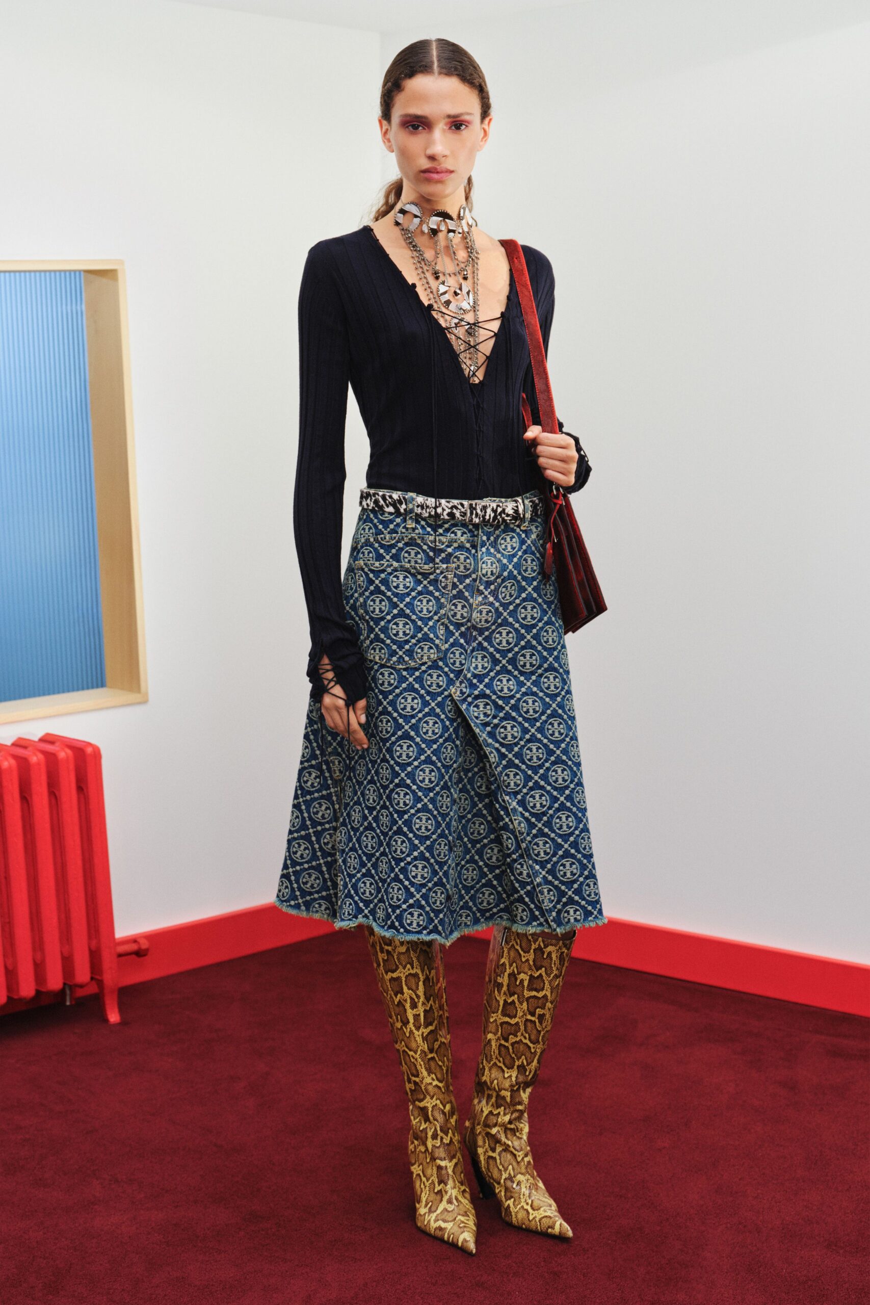 black fitted top with blue midi skirt