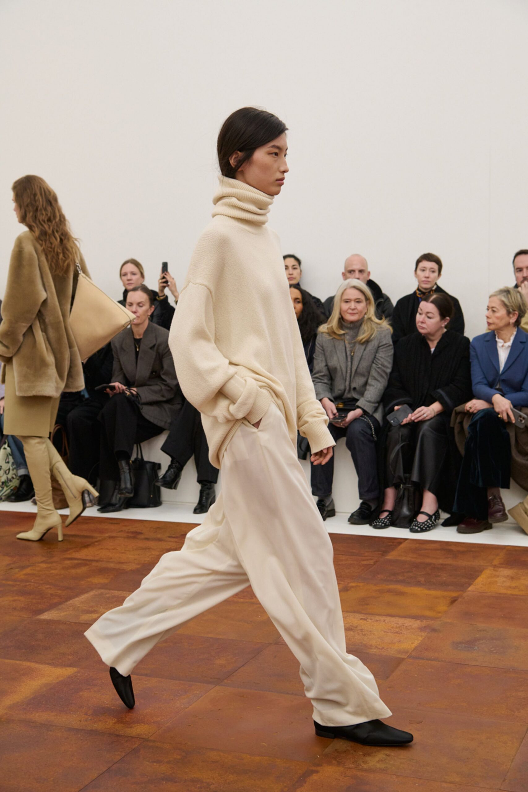 beige relaxed sweater and white pants