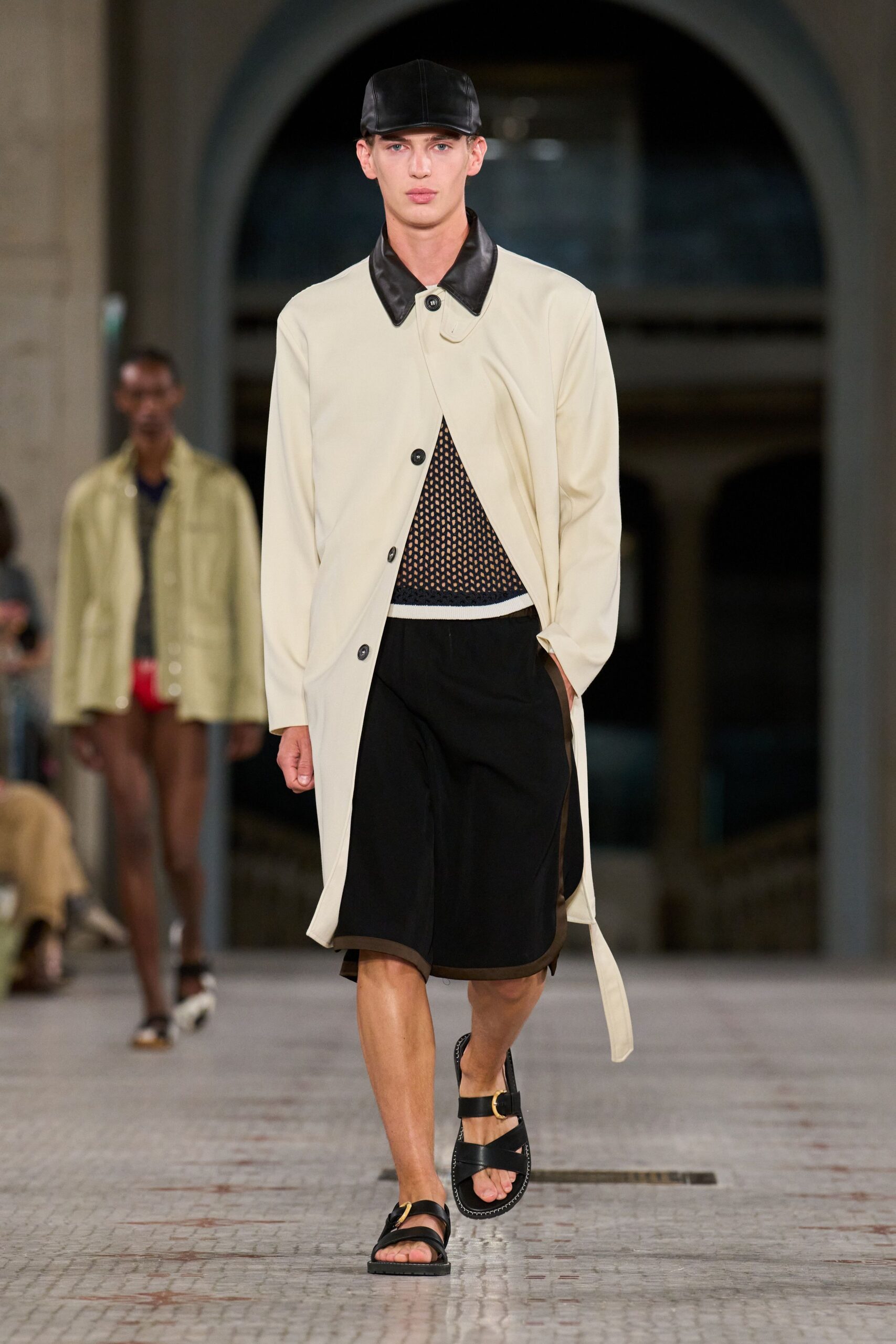 beige coat black top shorts sandals