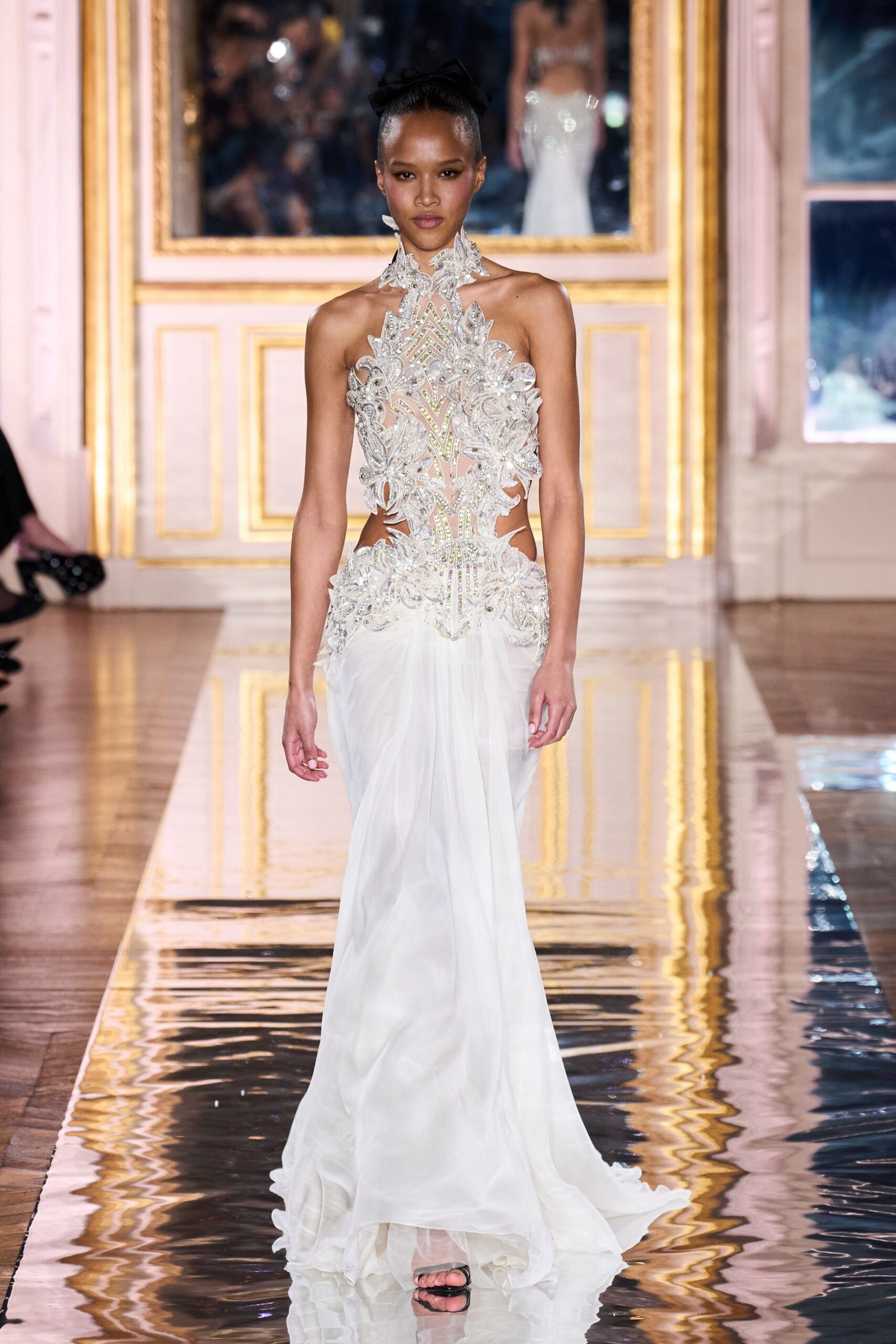 white embroidered sleeveless gown