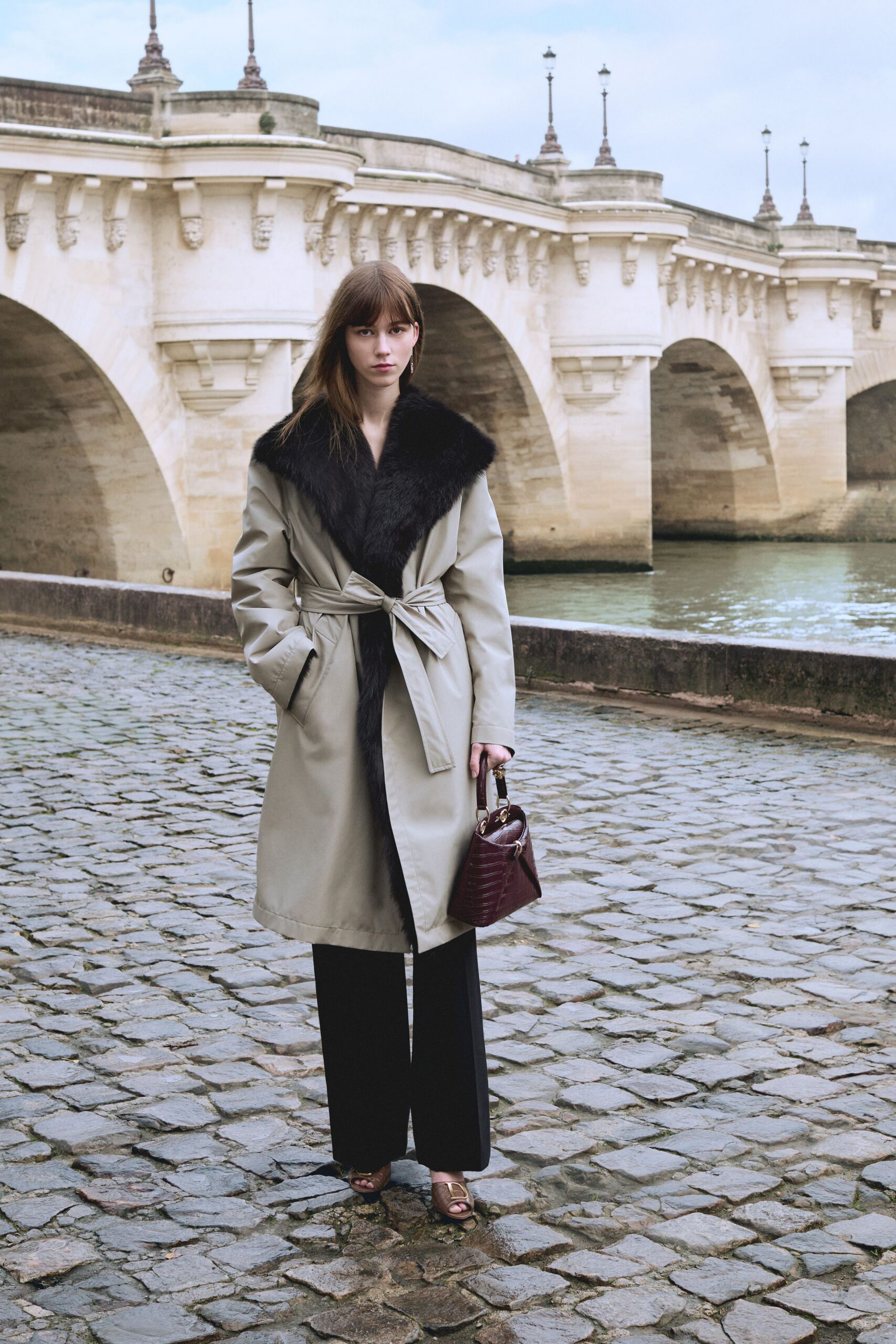 beige coat with black pants
