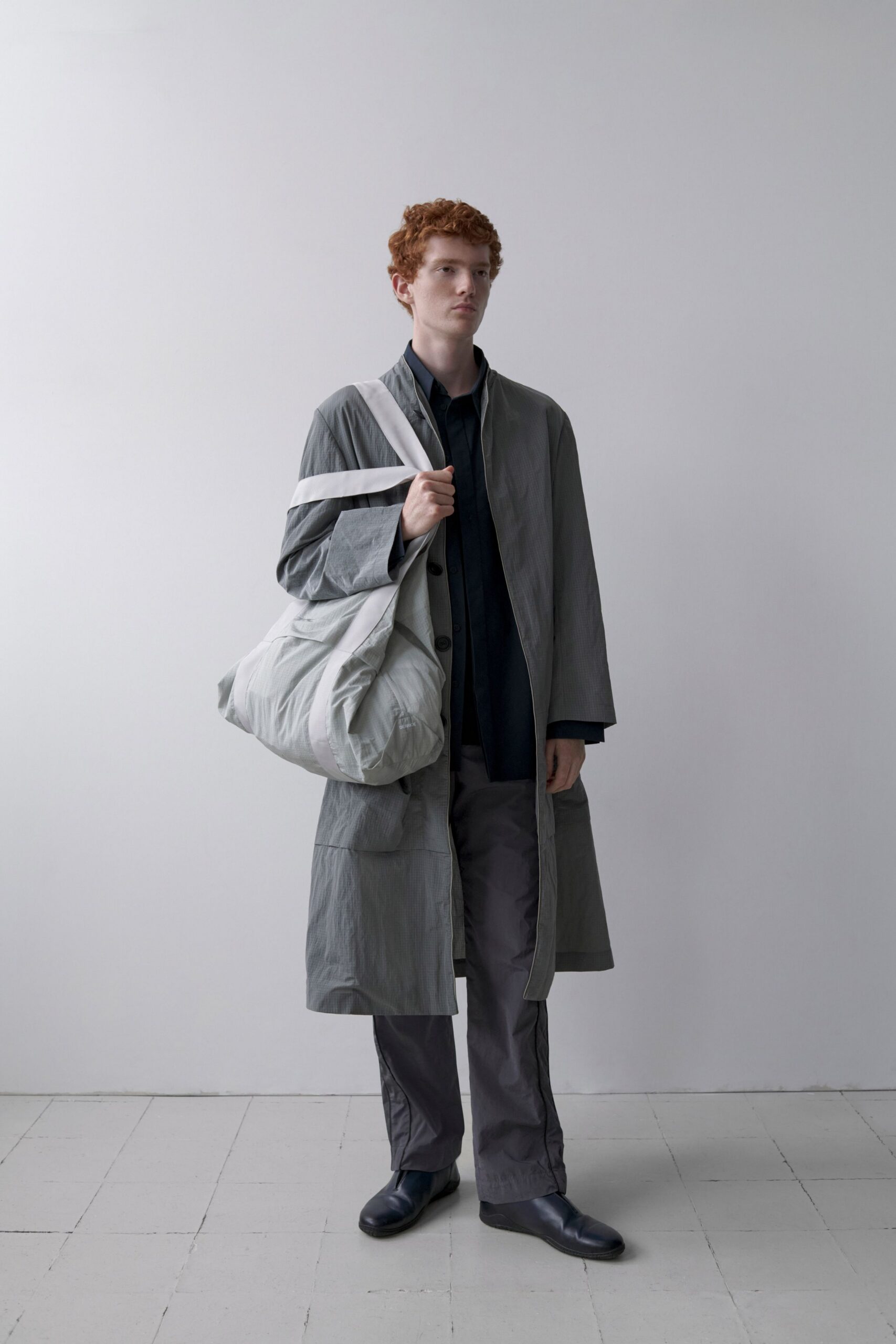 gray coat black shirt relaxed outfit