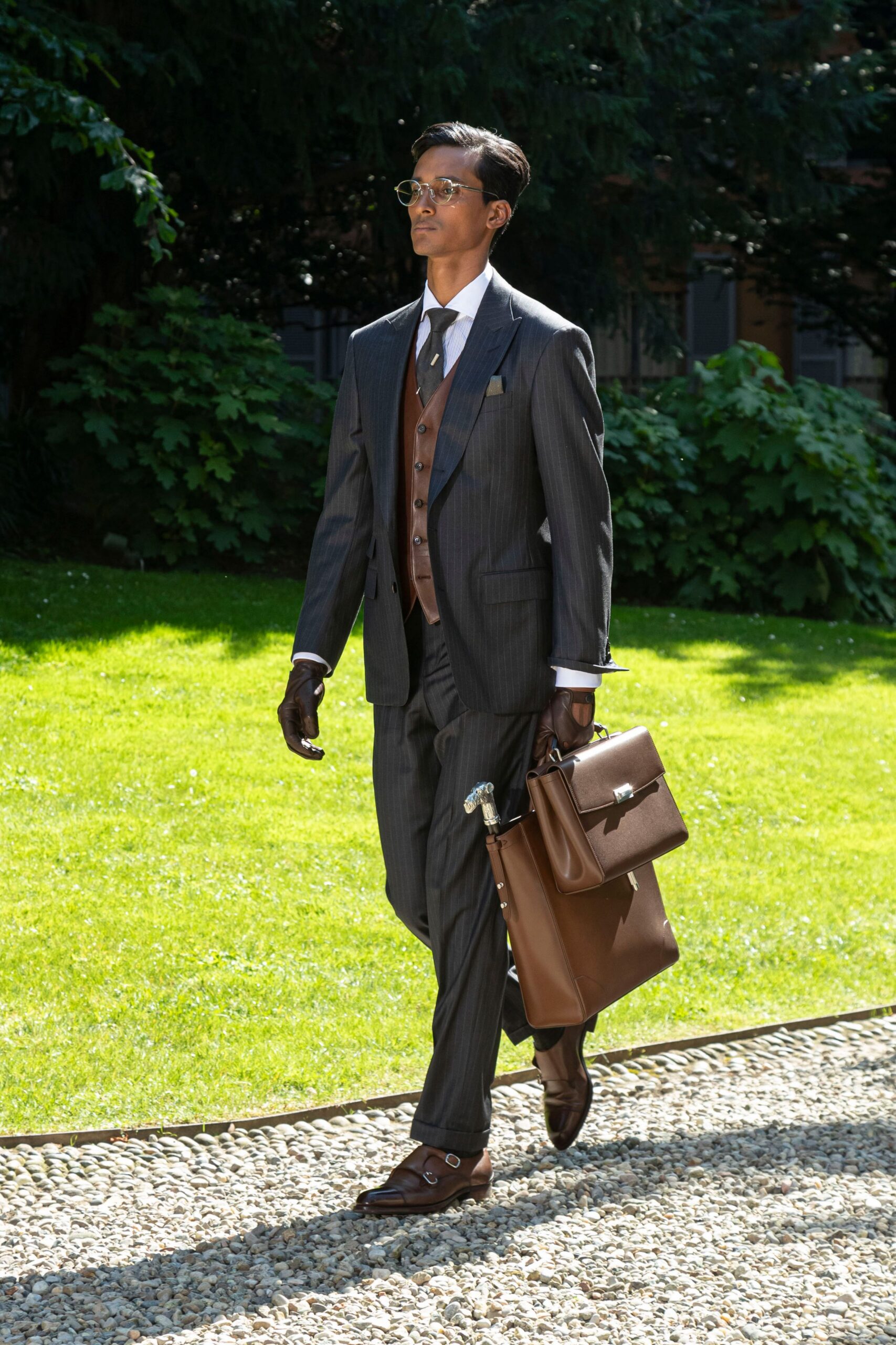 gray tailored suit with brown accessories