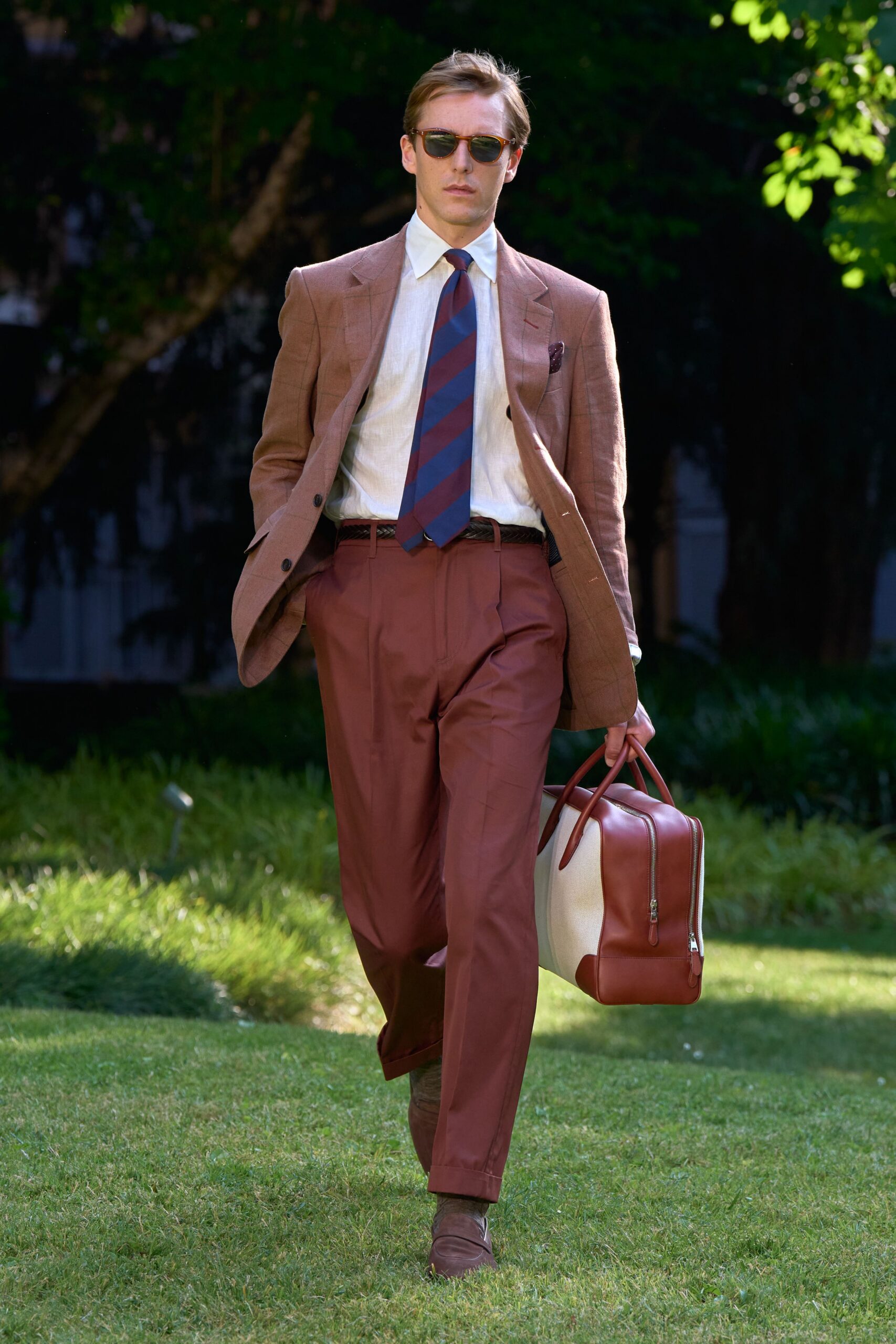 brown tailored suit with leather bag