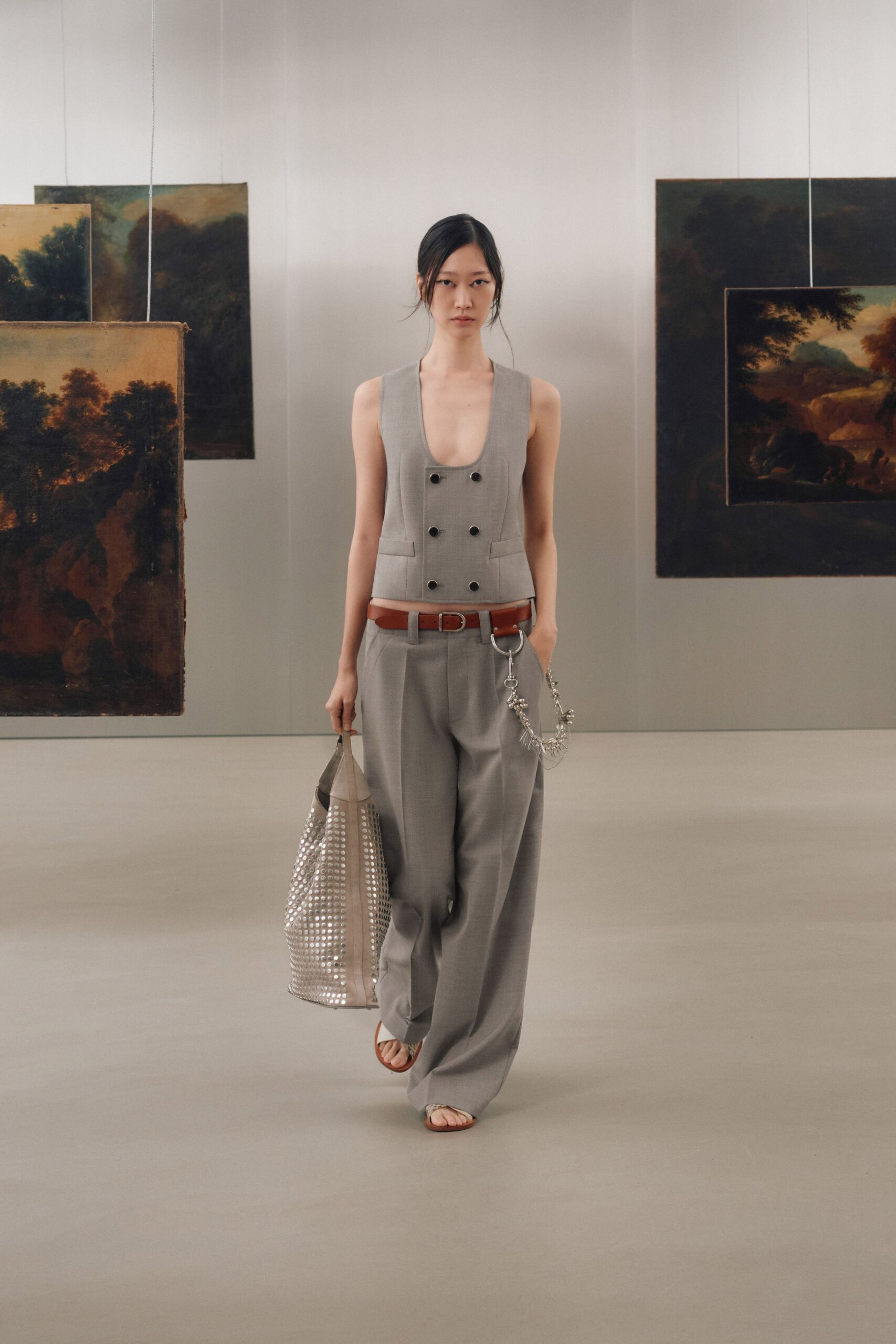 gray fitted vest with wide-leg pants